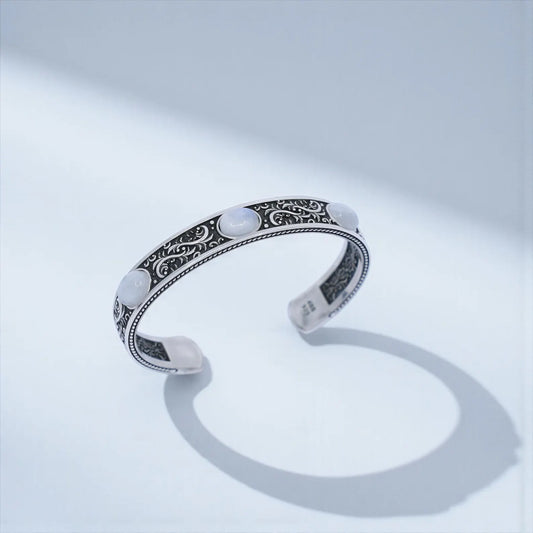 Handcrafted 925 sterling silver moonstone cuff bracelet for men featuring three natural moonstone gemstones set in a bold vintage-engraved Baroque design. Oxidized and hand-polished finish, ideal as a unique Christmas, anniversary, or birthday gift.