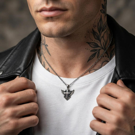 Close-up view of a handcrafted 925 sterling silver Winged Cross pendant showcasing ornate Baroque patterns, beautifully sculpted wings, detailed Christian cross symbolism, and an oxidized vintage finish that highlights exceptional artisan craftsmanship.
