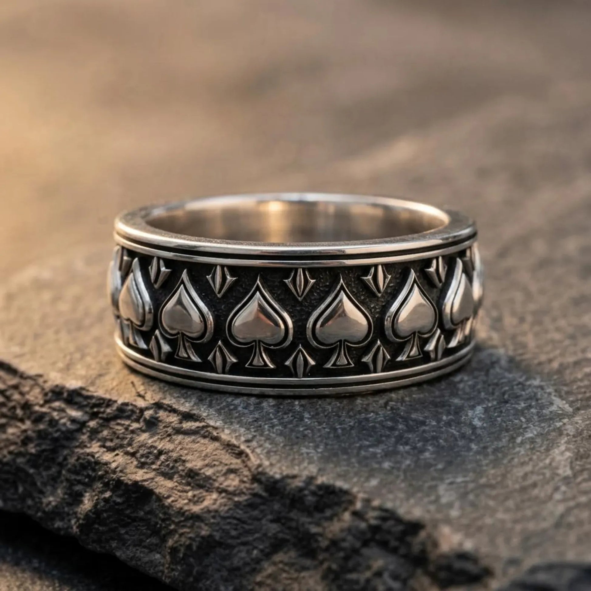 Bold Poker Player Ring handcrafted from sterling silver with ornate Gothic engravings and oxidized accents, combining masculine elegance with rebellious individuality.