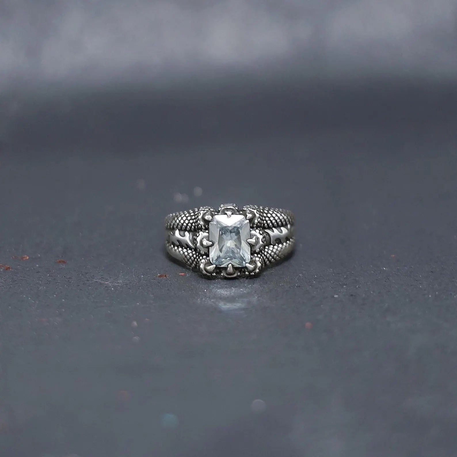 Elegant aquamarine birthstone ring with handcrafted precision, featuring a vibrant blue gemstone secured by a durable claw setting for a modern masculine look.