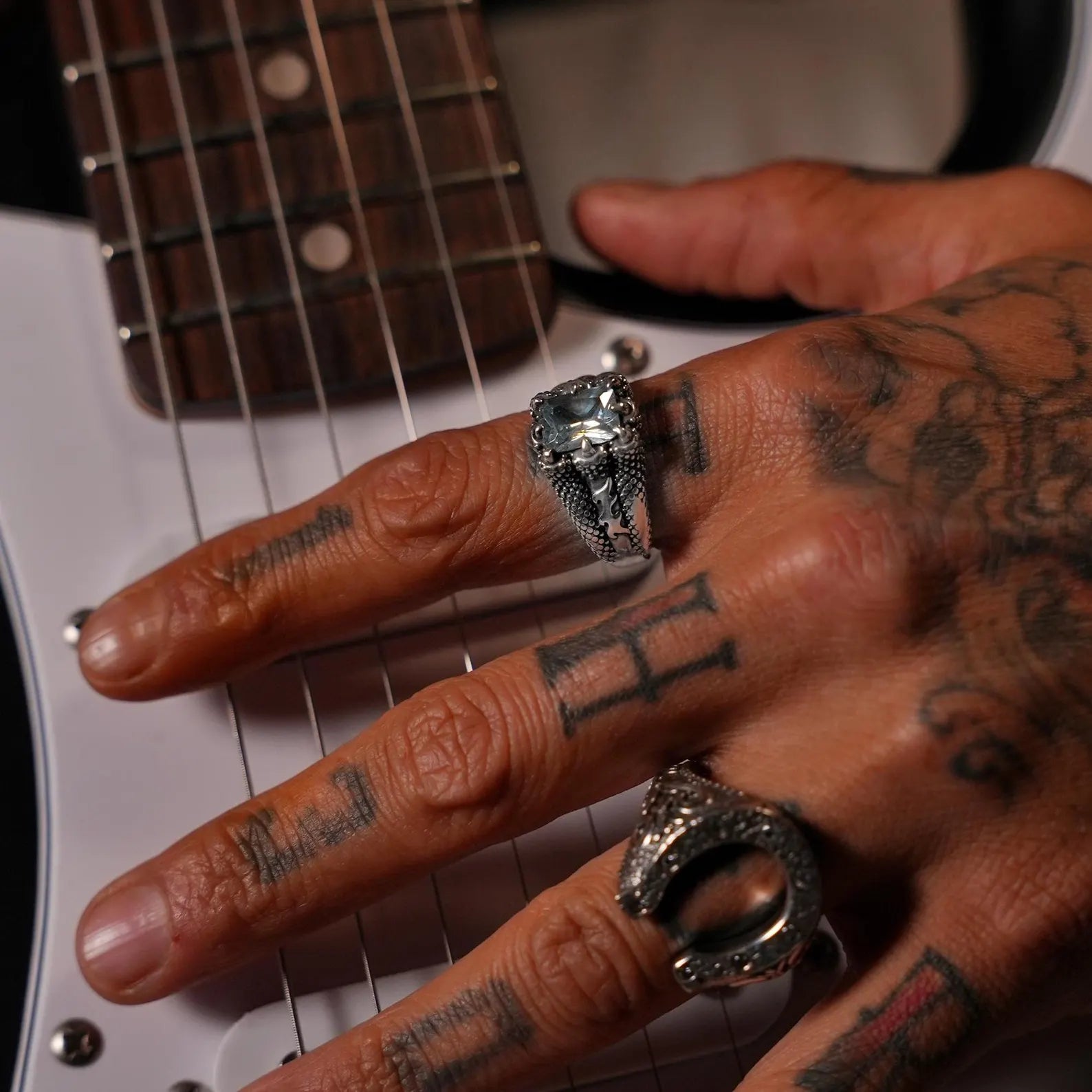 Close-detail macro shot of a handcrafted aquamarine ring with claw prongs, showcasing the gemstone’s rich blue tones and the ring’s polished sterling silver finish.