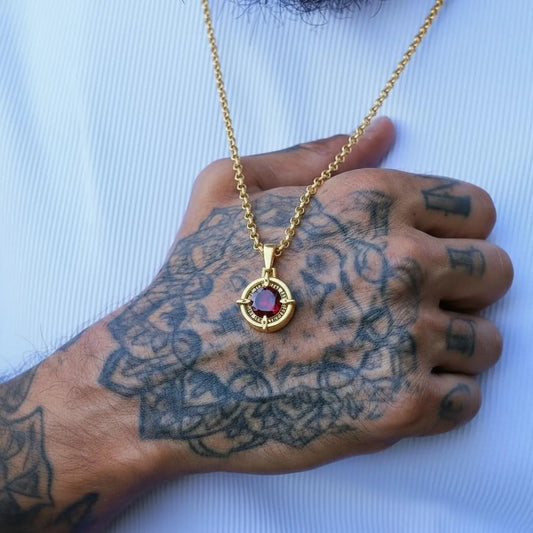 Custom compass necklace with garnet birthstone on gold plated sterling silver, personalized engraving option for name or date.