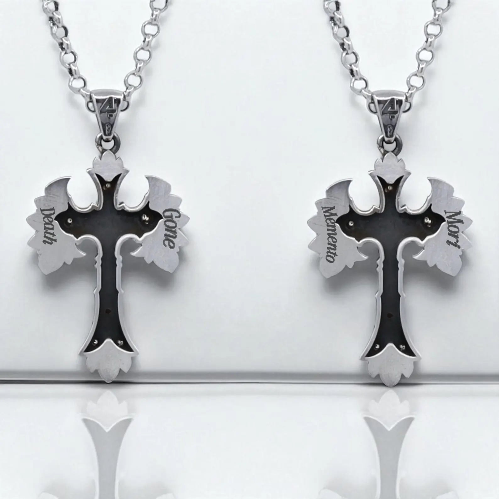 Detailed view of a gothic-style necklace with a cross-shaped pendant featuring a skull and wings, finished with high-quality sterling silver and gold plating. The design evokes ancient warrior energy and spiritual rebellion. A perfect accessory for alternative fashion lovers, offering a unique and handcrafted touch to any outfit.