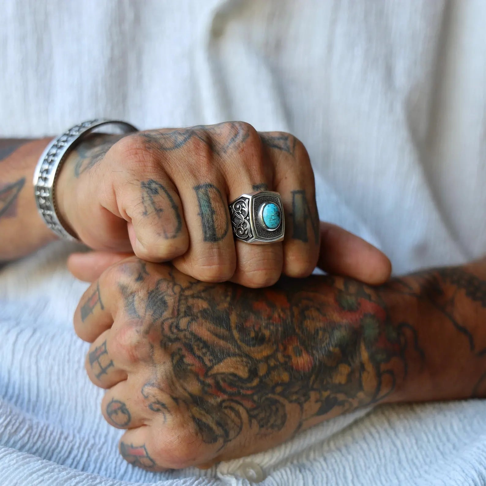 Artisan-made turquoise stone ring in gothic style, designed for men who value unique gemstone jewelry with symbolic depth, featuring a heavy silver band and medieval-inspired craftsmanship.