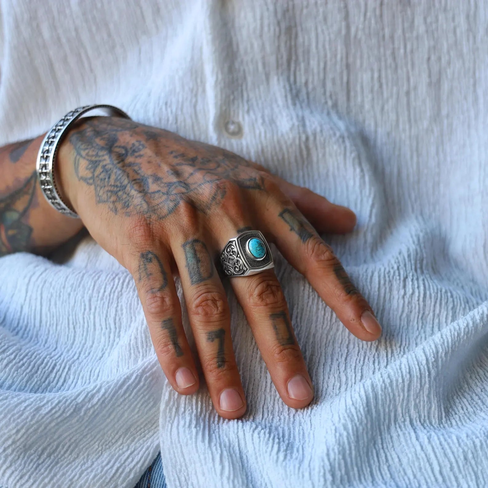 Gothic turquoise ring handcrafted in sterling silver for men, showcasing detailed metalwork and a vivid blue stone that represents protection and timeless elegance — a perfect gift for him.