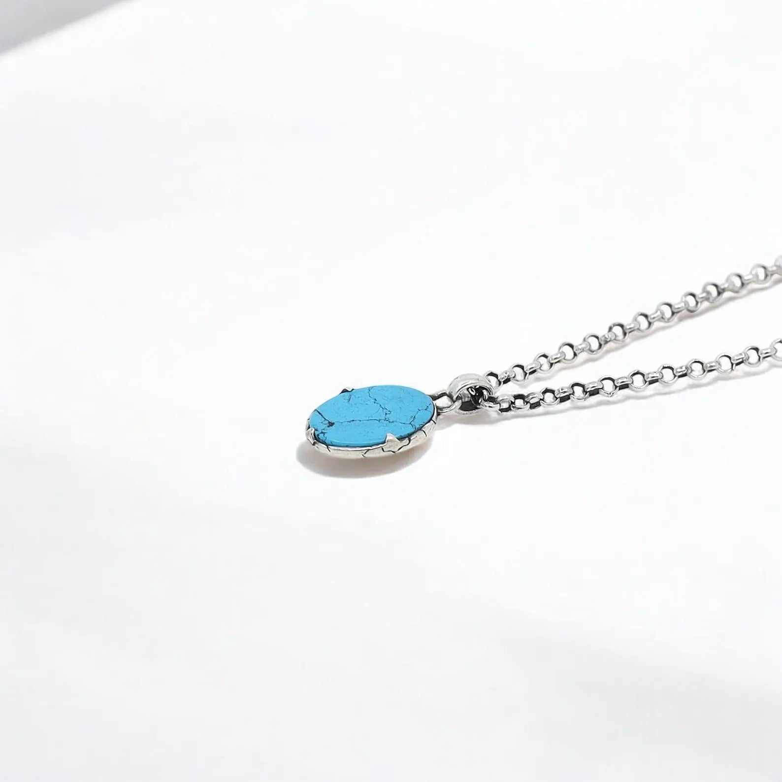 Artisan-crafted turquoise pendant necklace with a uniquely designed sterling silver setting. The marine-inspired shape and bright blue stone create a powerful statement for anyone who loves handmade, symbolic jewelry.