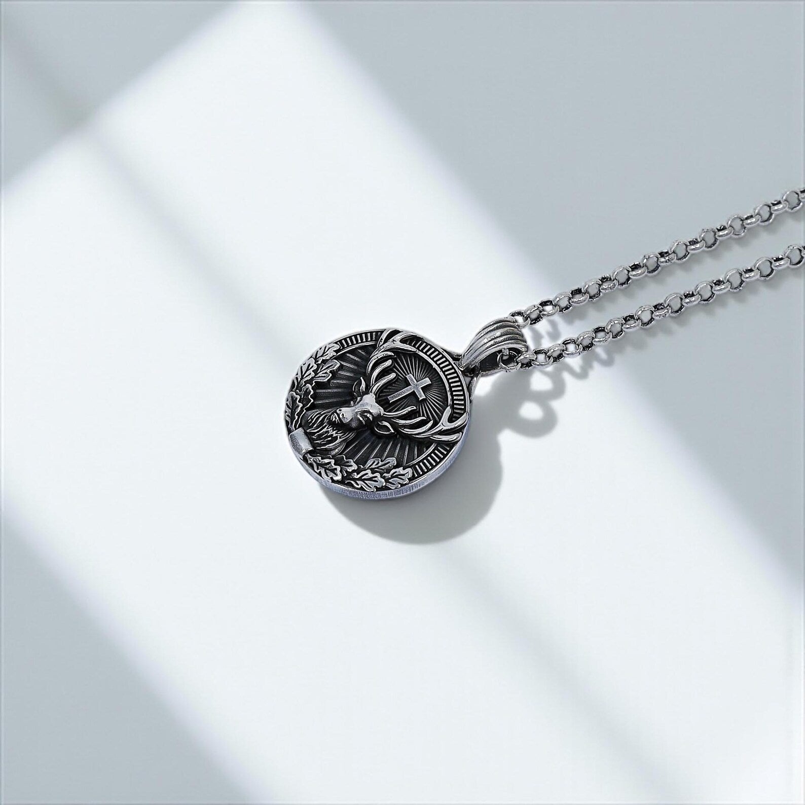 Sterling silver unisex pendant necklace showcasing the sacred imagery of St. Hubertus with intricate craftsmanship; a perfect blend of boho style and Christian symbolism for modern wearers.