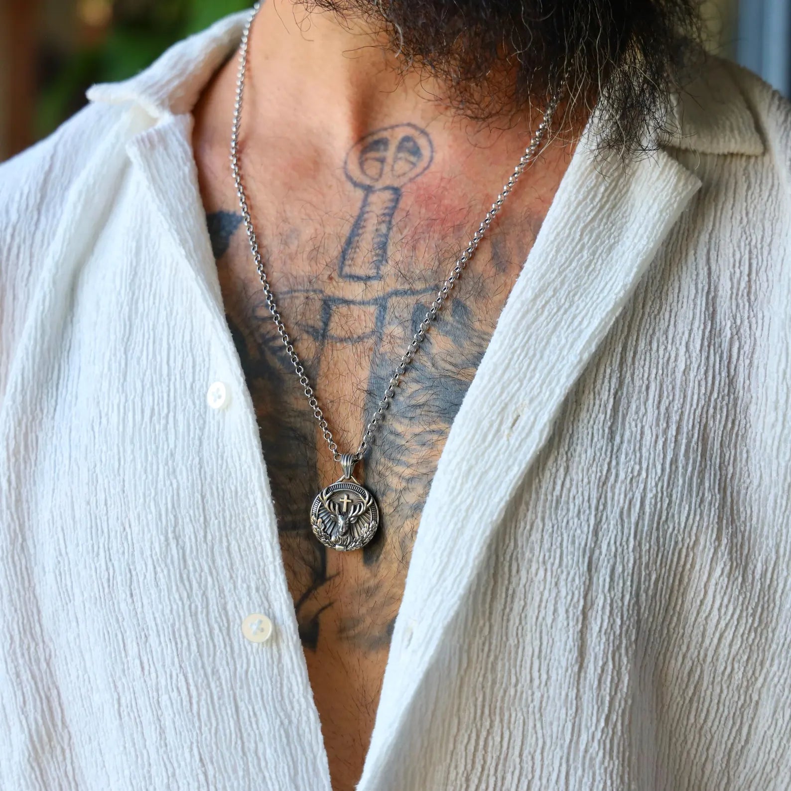 Close-up of a handcrafted St. Hubertus pendant necklace made of solid sterling silver, featuring the iconic image of the saint and the stag, symbolizing faith and protection, ideal as a timeless religious gift for men.