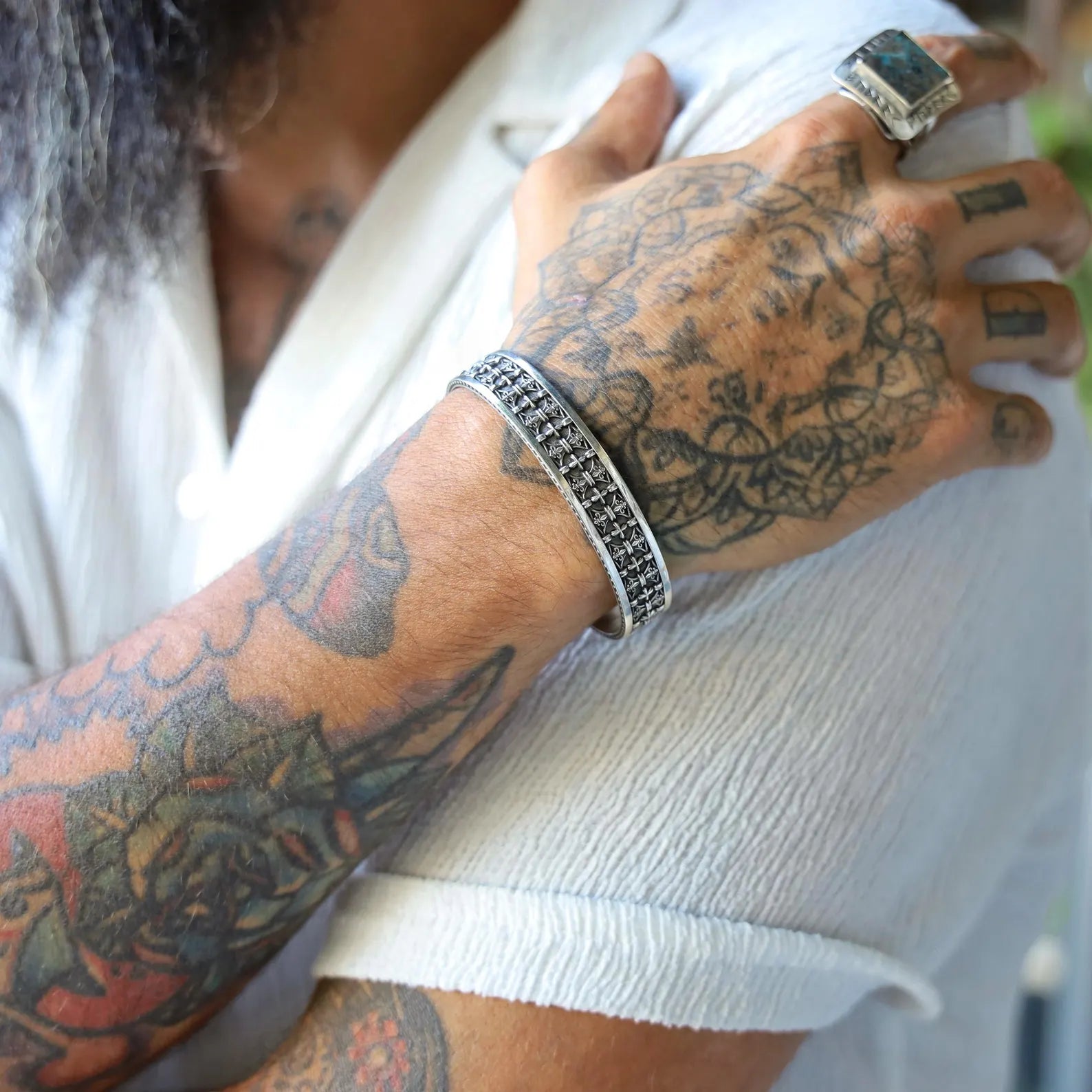 Bold and stylish, this handmade sterling silver cuff bracelet features gothic cross patterns carved into a textured surface, offering a powerful visual impact. It’s a refined piece of gothic biker jewelry for men who appreciate artisan craftsmanship and symbolic design. Makes a timeless gift for Christian men who love expressive and rugged jewelry.