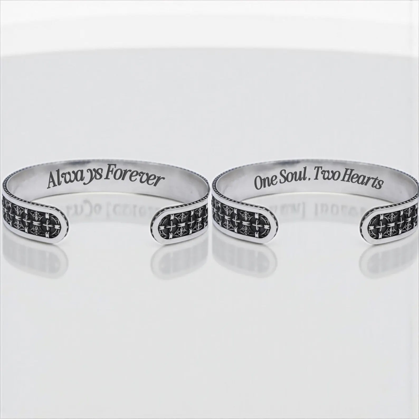 An elegant and edgy men's religious cuff bracelet crafted in solid sterling silver, showcasing an intricate line of gothic cross engravings. This bracelet is designed to fit comfortably with its open, adjustable band, making it perfect for daily wear or special occasions. A unique combination of biker style and spiritual expression.