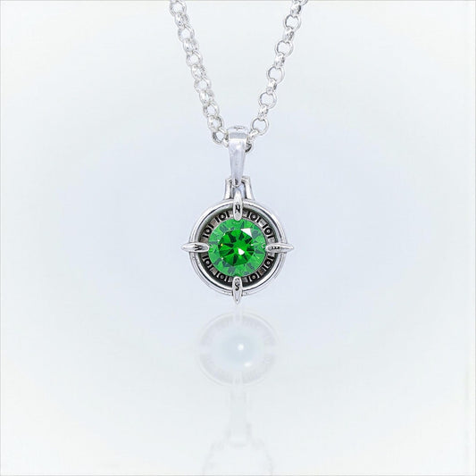 Handmade sterling silver compass necklace with a brilliant emerald green gemstone at the center. This nautical pendant symbolizes direction, guidance, and adventure. A meaningful jewelry gift for men and women who love traveling, sailing, or exploring. Perfect birthday or anniversary gift for those seeking unique handmade gemstone jewelry.
