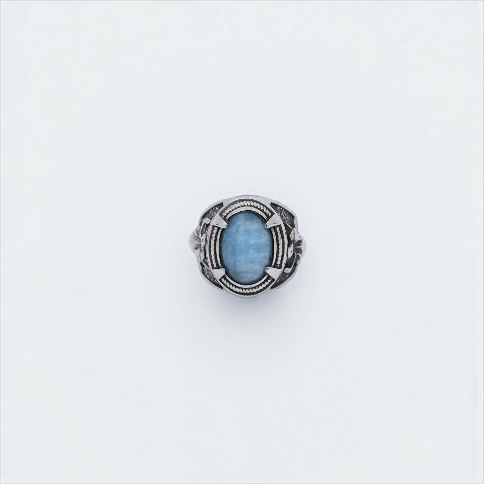Sterling silver wolf ring with natural aquamarine gemstone, handcrafted in Viking style for men who admire Norse mythology. Featuring a bold wolf design symbolizing strength and courage, this ring makes a powerful statement. Ideal as a unique gift for him, gothic or biker jewelry lovers, or Viking history enthusiasts.