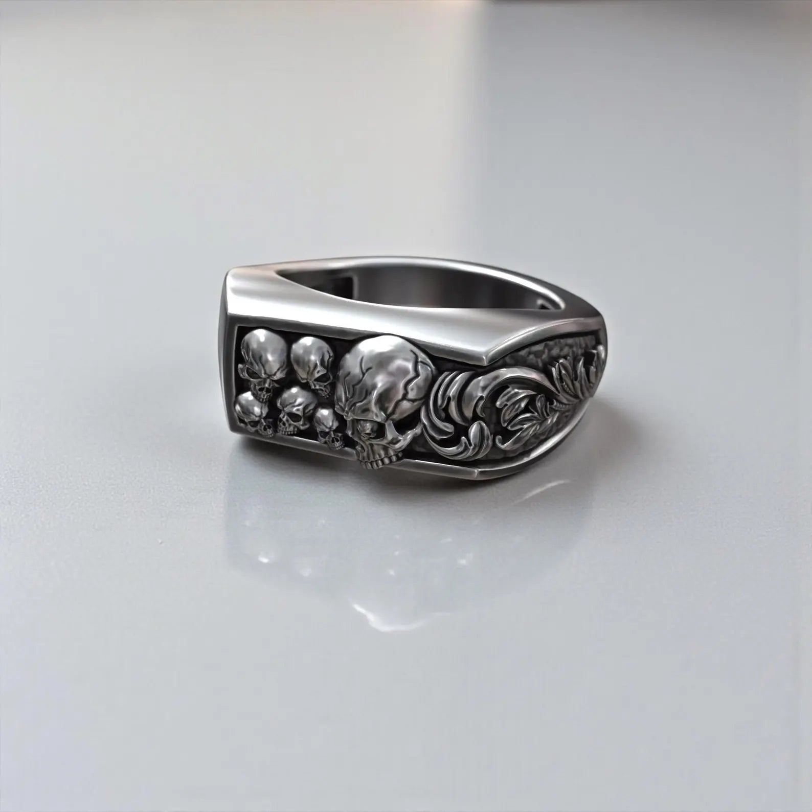Gothic jawless skull ring made of solid sterling silver, detailed baroque floral engraving, memento mori symbolism, biker style men’s statement jewelry with dark oxidized contrast