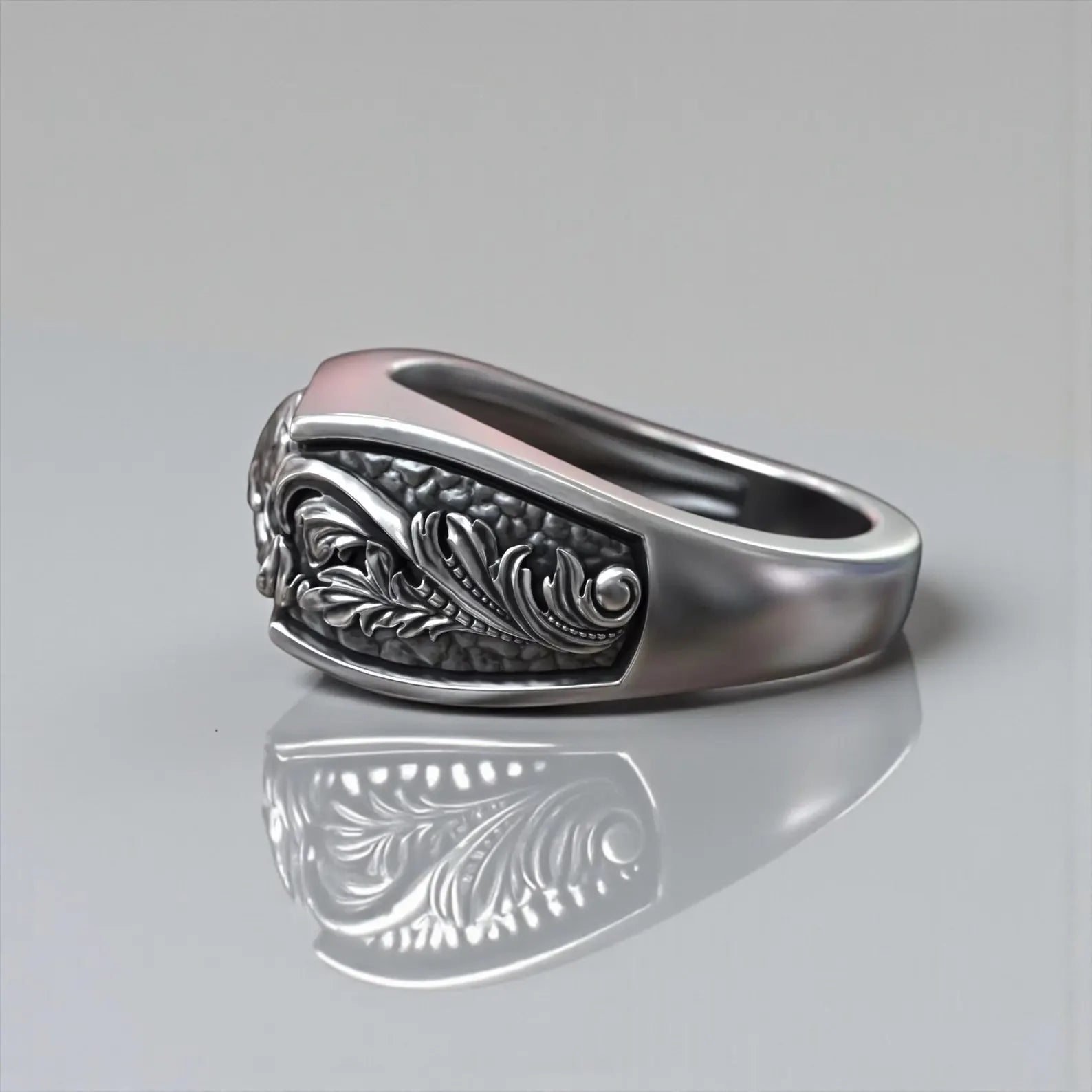 Sterling silver jawless skull biker ring featuring ornate baroque floral design, handcrafted gothic men’s jewelry inspired by memento mori philosophy and timeless masculine rebellion