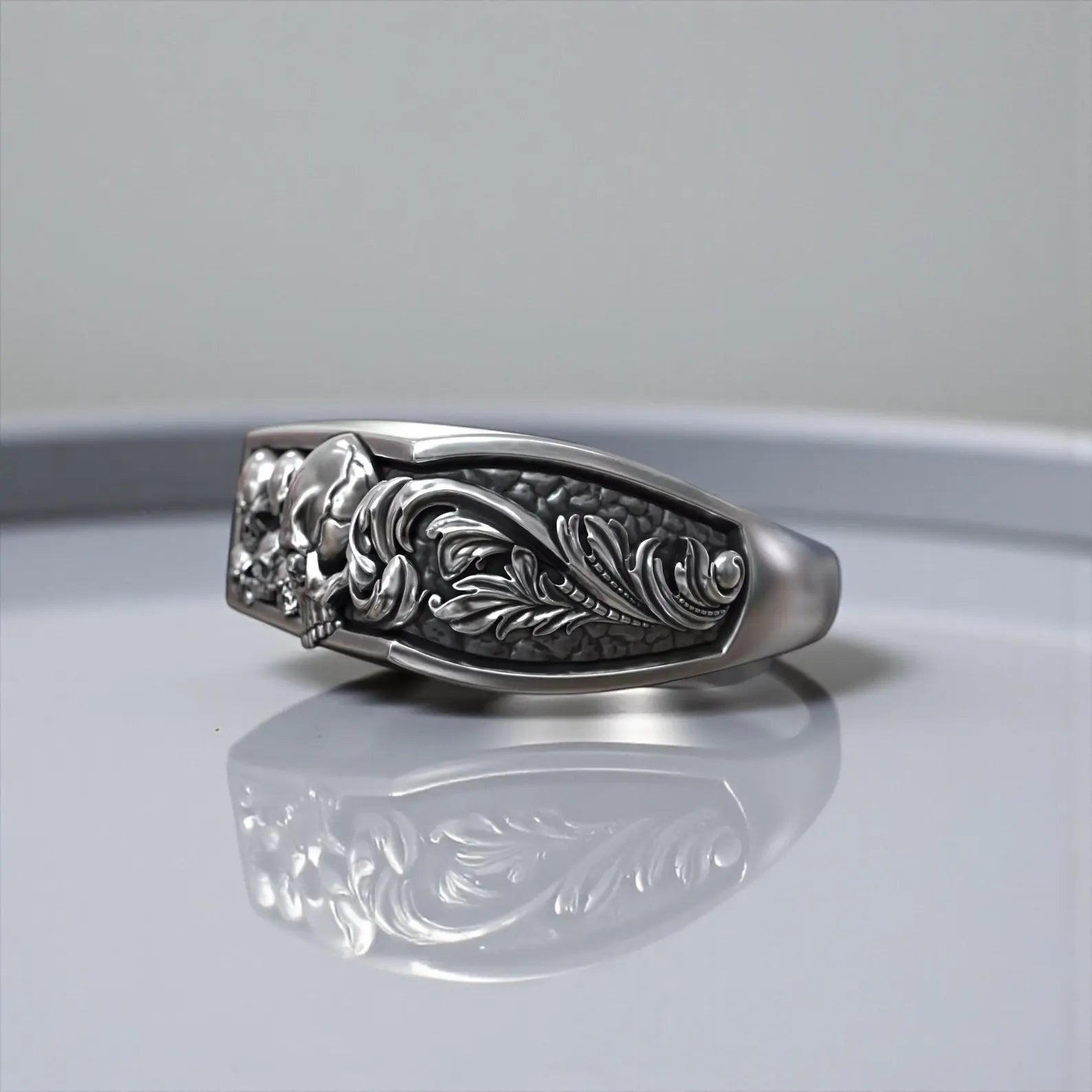 Bold gothic men’s ring crafted in 925 sterling silver, jawless skull motif with floral baroque details, oxidized finish, memento mori statement biker jewelry