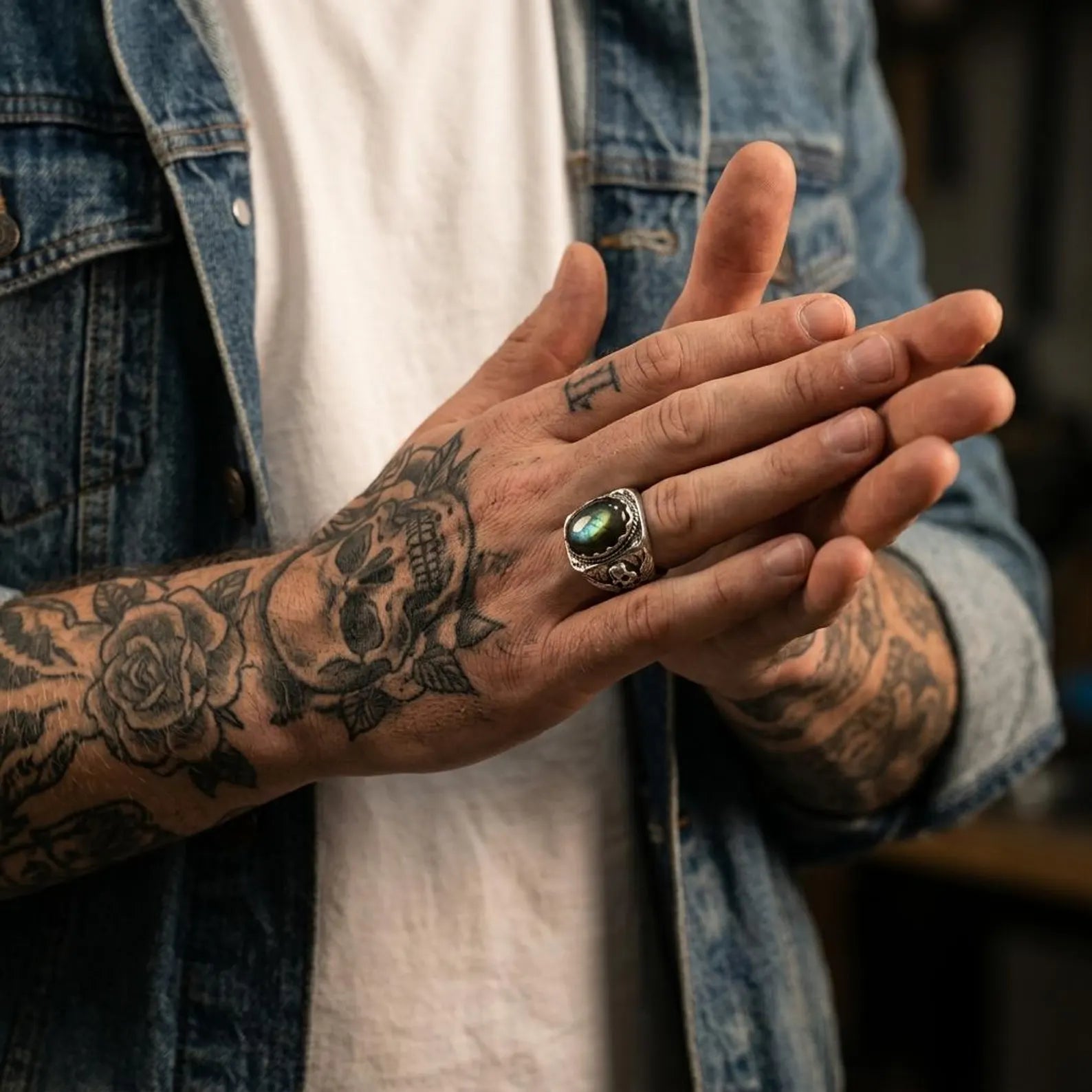 heavy skull ring with labradorite stone made from high-quality 925 sterling silver, polished and oxidized finish for a striking contrast