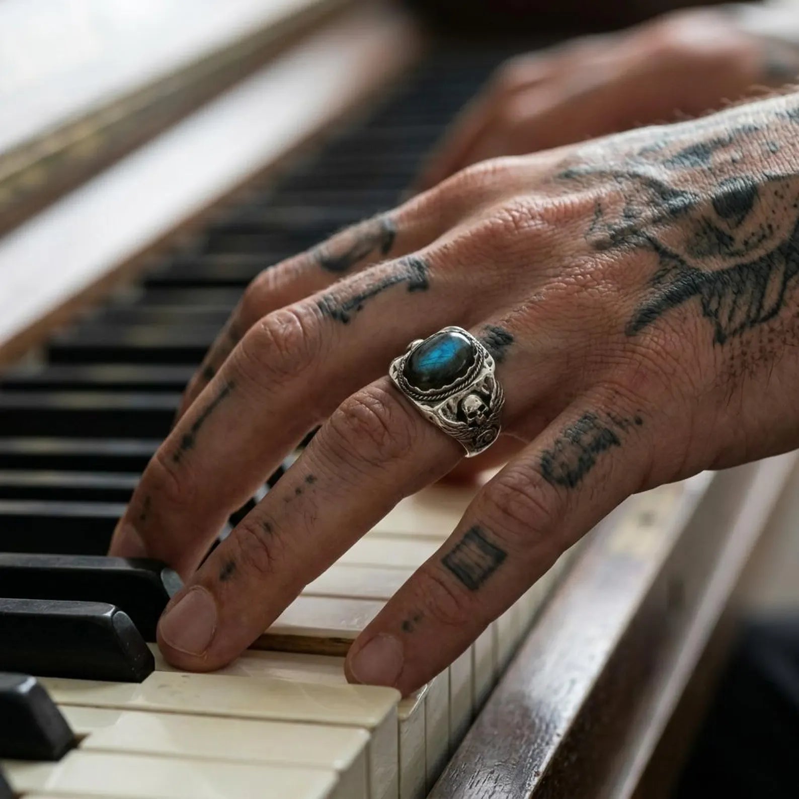 unique skull ring featuring a natural labradorite stone set in solid 925 sterling silver, oxidized finish with detailed craftsmanship and masculine style