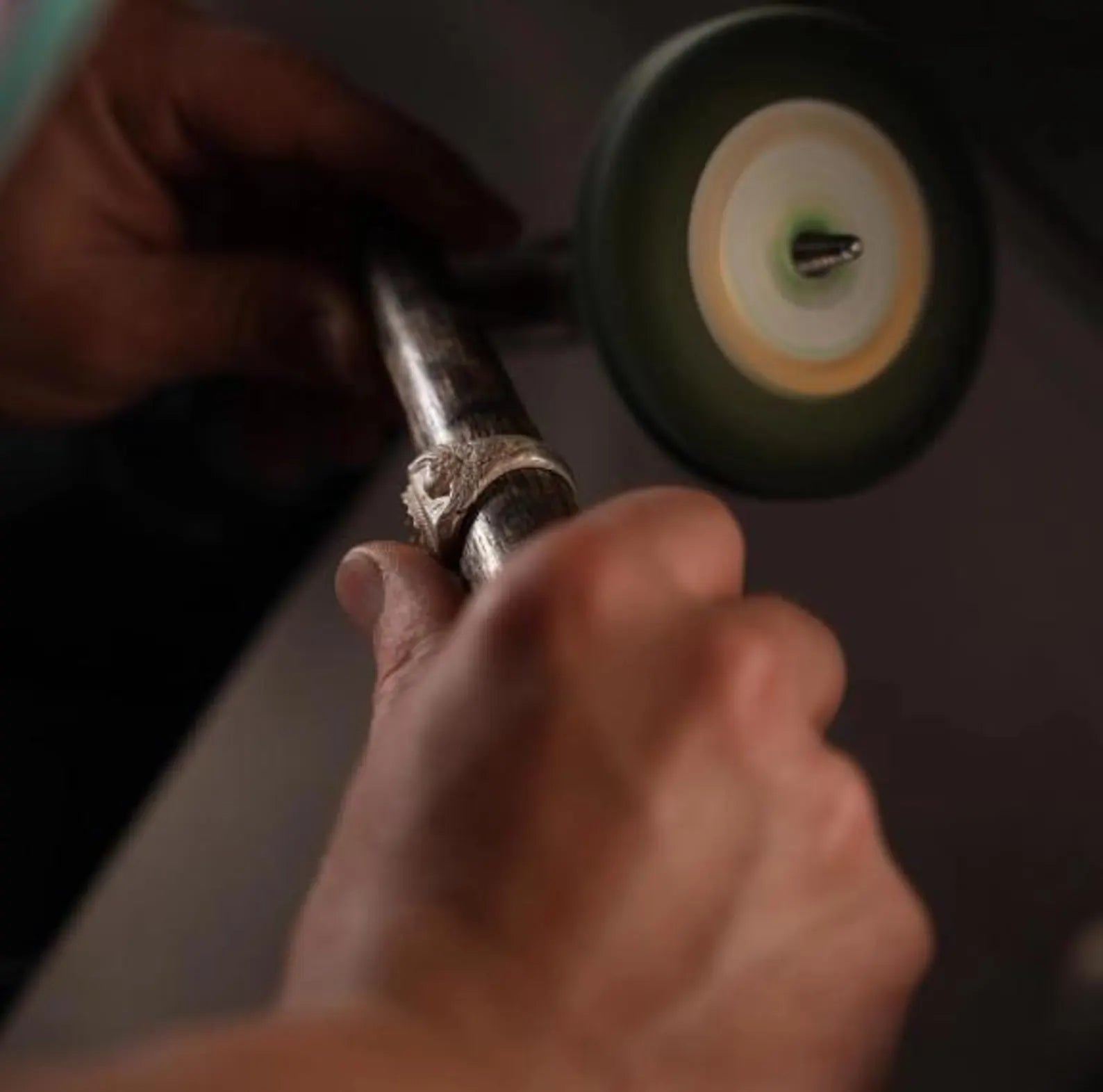 A stunning silver biker ring with an iridescent labradorite centerpiece and finely sculpted skull wings, symbolizing transformation, protection, and rebellious strength. This handcrafted statement piece is ideal for gifting to a man with bold fashion taste and a love for gothic symbolism.