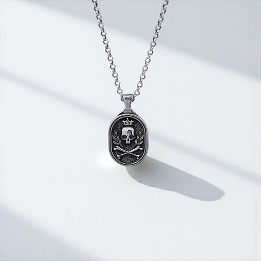 Close-up image of a men's gothic skull pendant necklace, handcrafted in sterling silver and featuring a detailed crowned skull design with crossed bones, perfect for biker style and bold gothic fashion lovers.