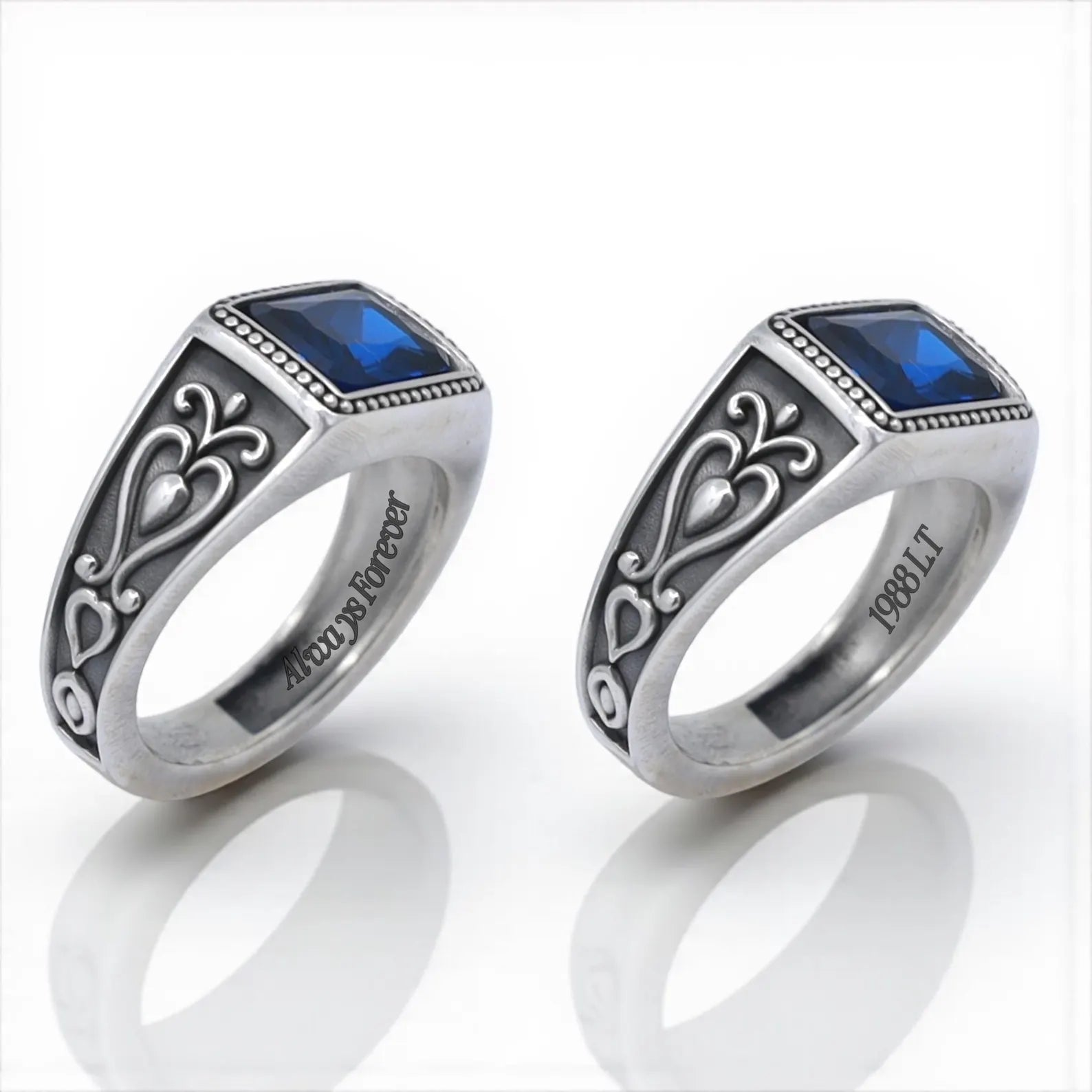 Handcrafted silver men’s ring with a bold square-cut blue gemstone and intricate gothic engravings on the band, symbolizing elegance, confidence, and timeless masculine energy.