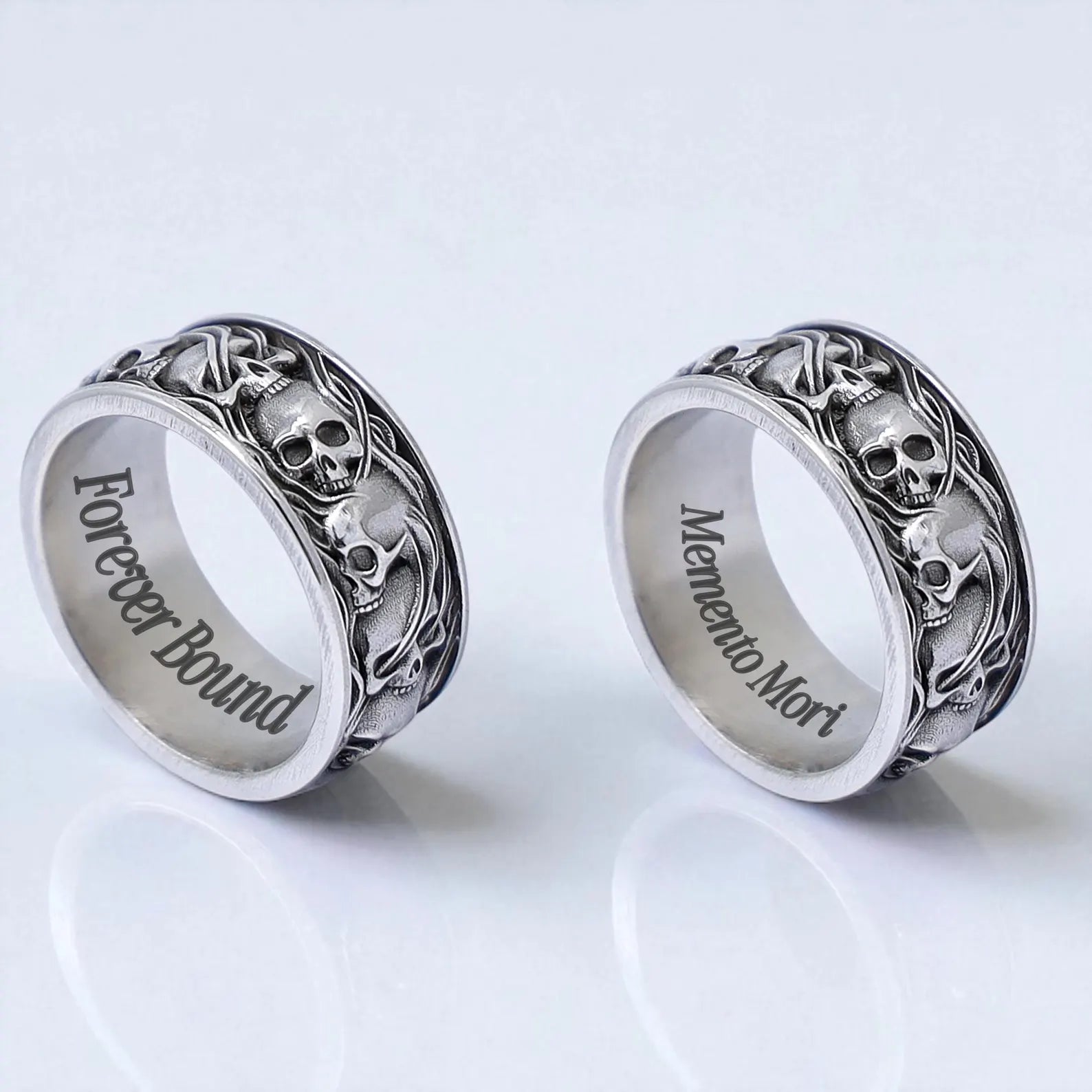 This gothic biker-style ring is crafted from high-quality 925 sterling silver, showcasing multiple raised skulls wrapped around a thick masculine band. Its rugged, handmade design evokes a rebellious spirit and is ideal for fans of alternative culture, rock fashion, or men’s statement jewelry. A perfect gothic gift for him.