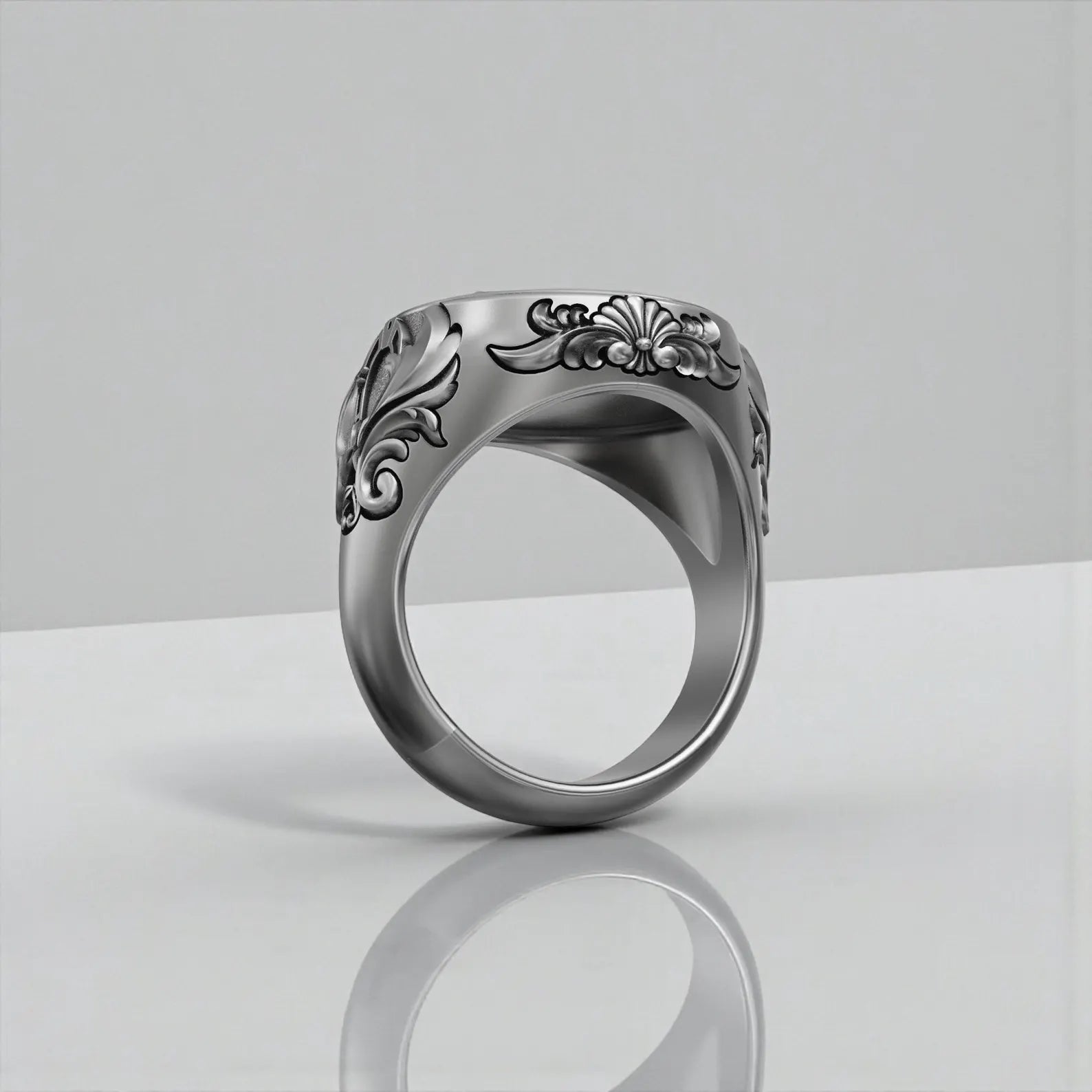 Side angle view of winged horse statement ring for men, showcasing thick 22mm band width and detailed artisan carving in handcrafted sterling silver