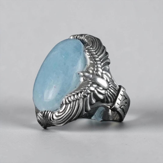 For those seeking a non-traditional engagement or promise ring, this handcrafted piece offers a unique alternative. The combination of aquamarine and an eagle design symbolizes peace and commitment, perfect for couples who value individuality.