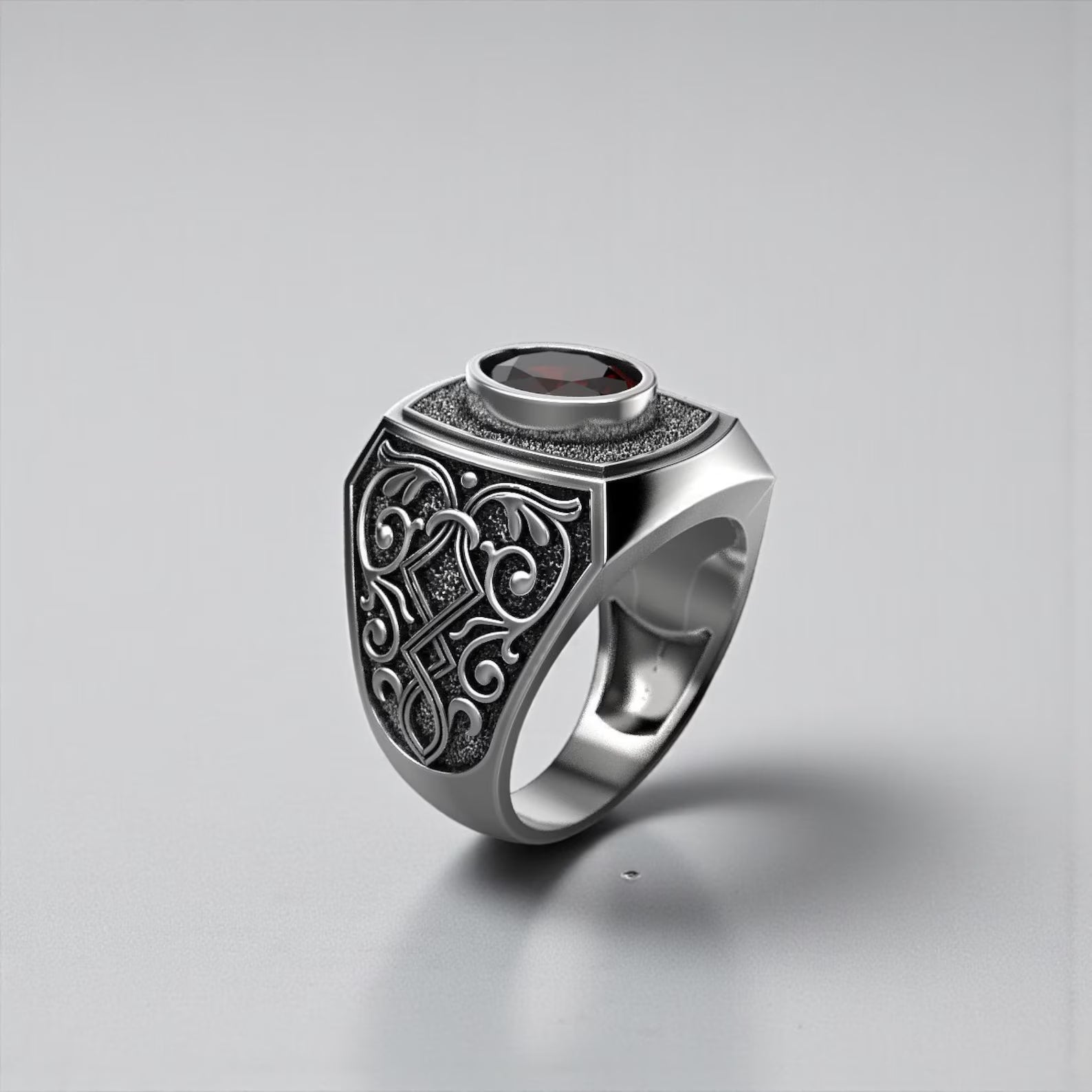 Bold gothic jewelry ring for men featuring red garnet birthstone, oxidized sterling silver signet ring with vintage engraved patterns