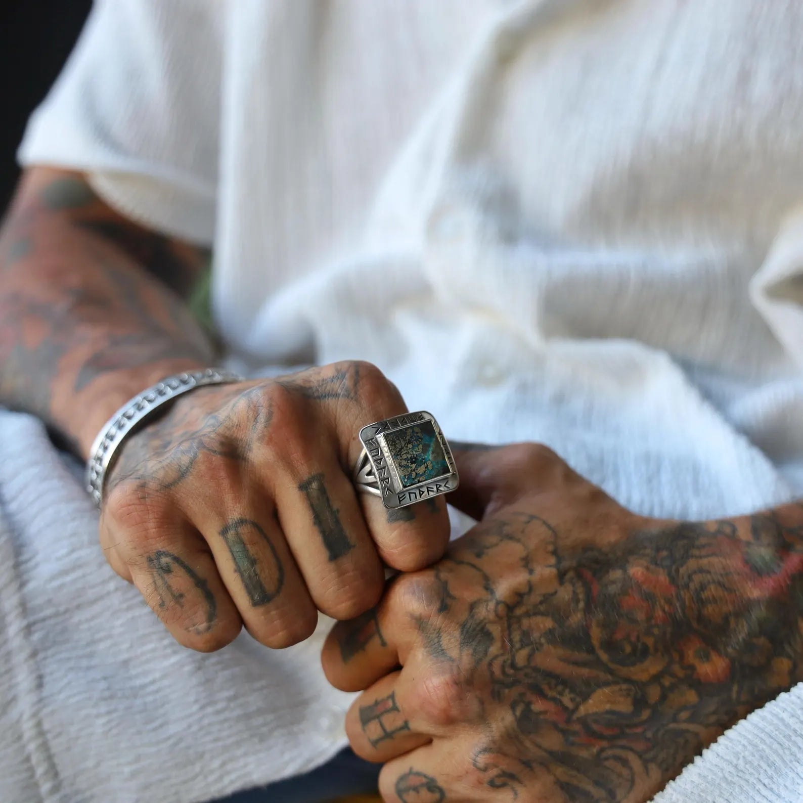 Bold Viking ring for men featuring a natural turquoise stone and authentic rune carvings. Artisan-made in sterling silver, this statement piece honors Norse tradition and Nordic mythology. Ideal for Google image search, Shopify Viking product pages, and medieval fashion lovers.