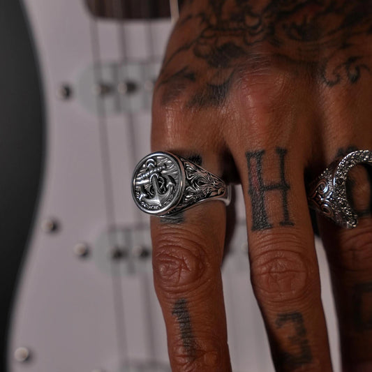 Celebrate your connection to the sea with this handcrafted sterling silver anchor ring. The front-facing design highlights the detailed anchor symbol, representing strength and stability. A bold and stylish nautical piece perfect for men who value craftsmanship and meaning. Ideal for sailors, ocean lovers, and adventurers alike.