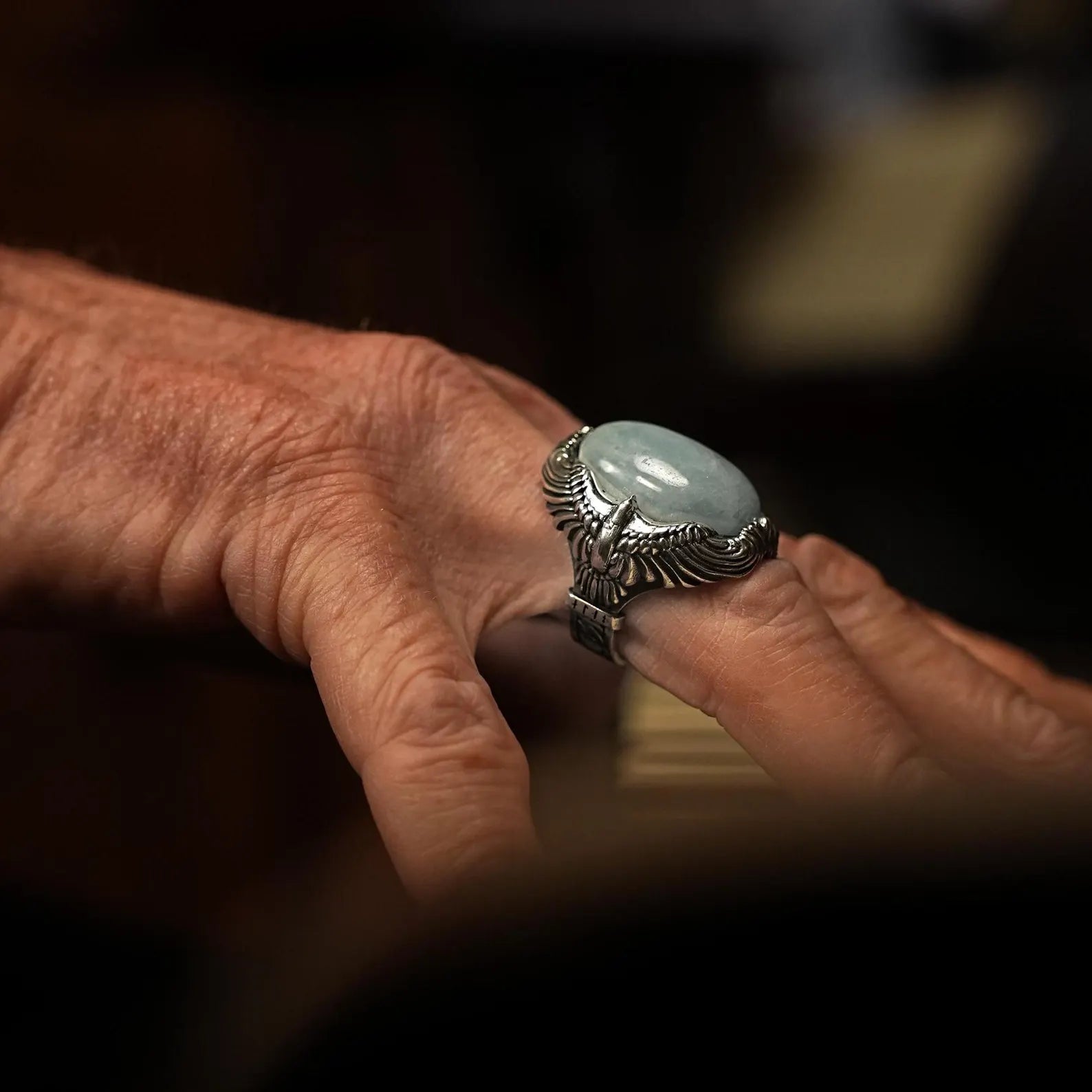 Embrace the spirit of freedom with this meticulously handcrafted sterling silver ring, showcasing a soaring eagle design and a captivating aquamarine gemstone. Symbolizing tranquility and strength, this piece is perfect for those seeking a unique accessory that embodies nature's elegance.