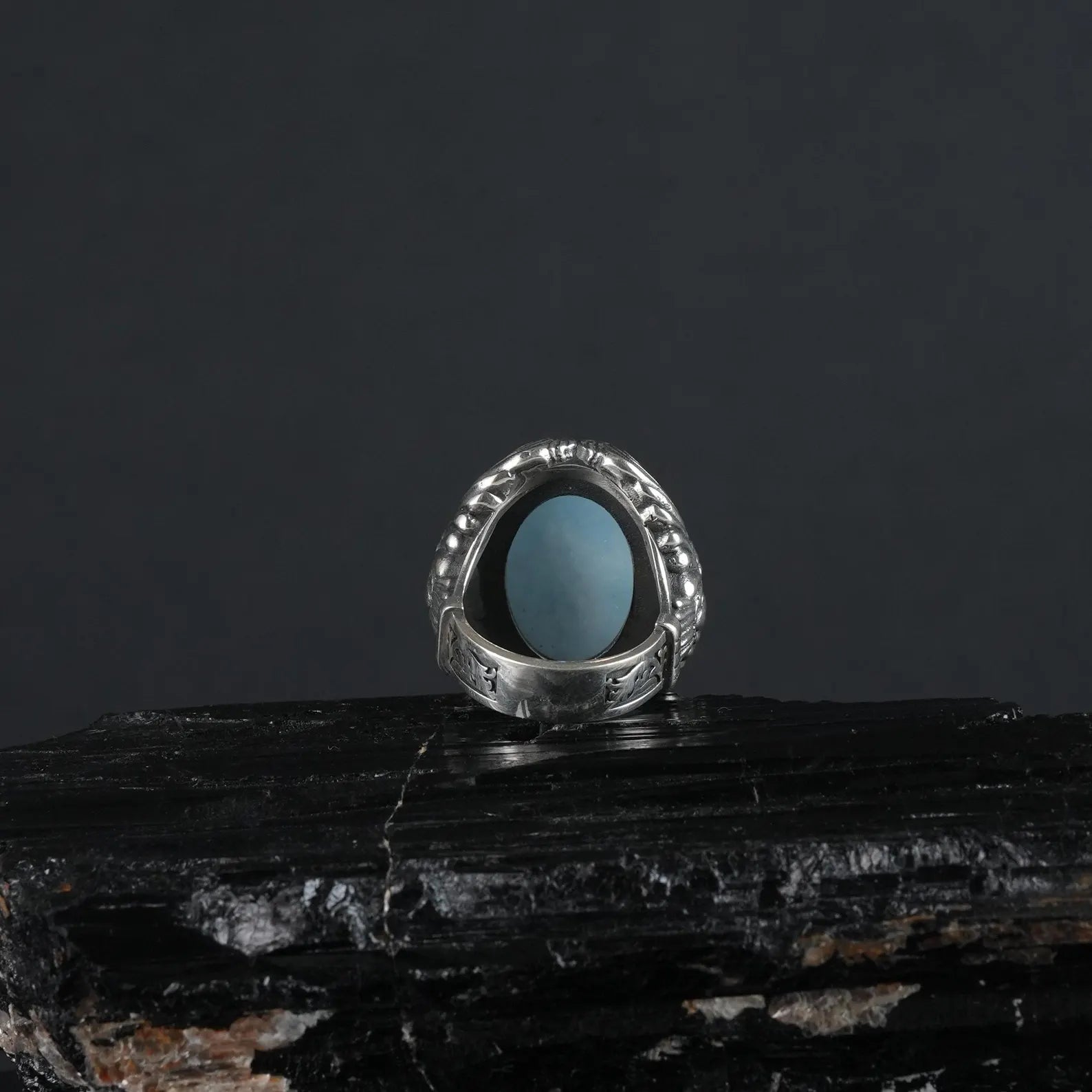 Channel the rugged spirit of biker culture with this sterling silver eagle ring, featuring a calming aquamarine gemstone. The detailed craftsmanship and bold design make it a standout piece for those who appreciate edgy, statement jewelry.