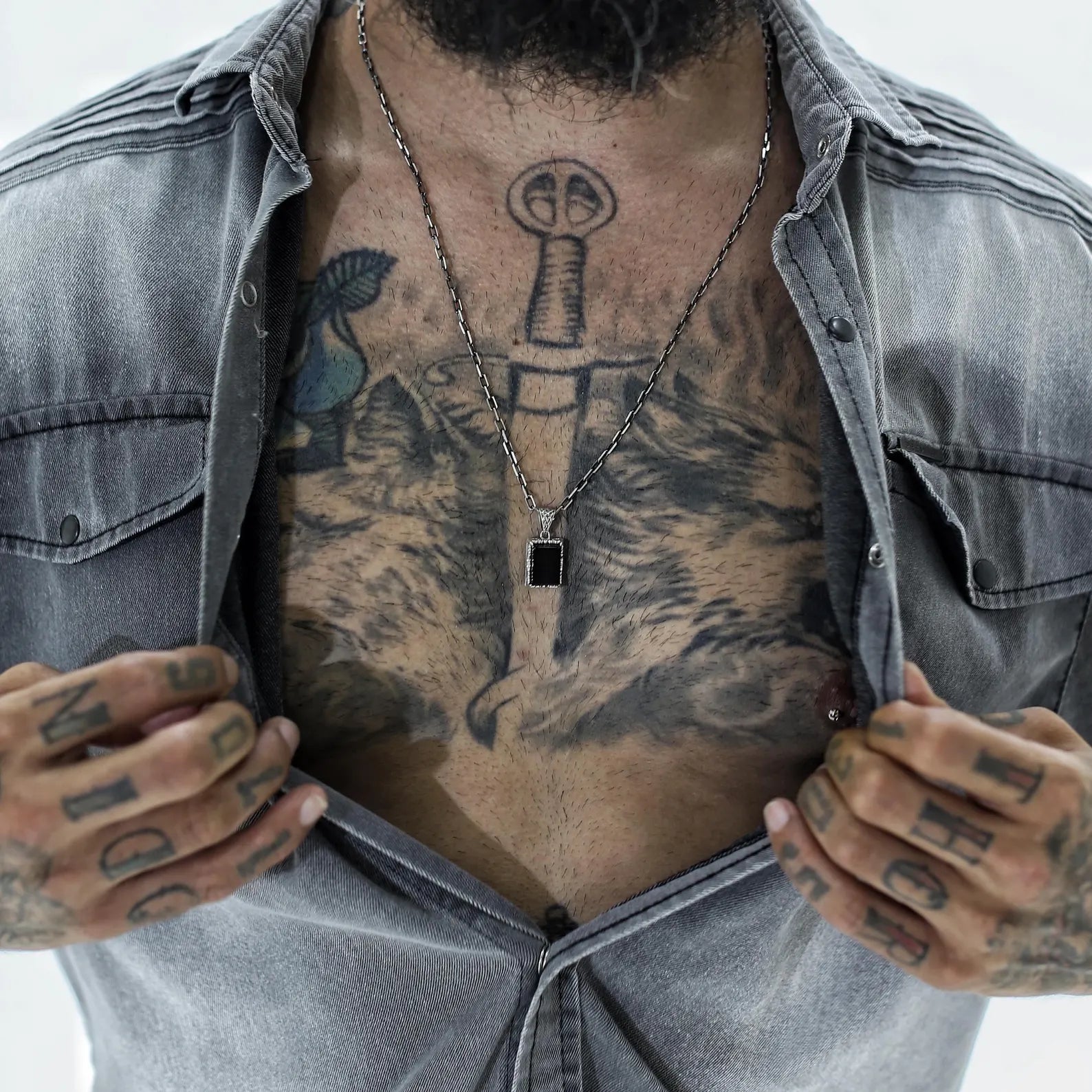 A sophisticated black onyx necklace crafted from sterling silver, featuring a small oval gemstone and floral-style engraving. This handcrafted design is rich with detail and sentiment, ideal for thoughtful gifts such as anniversaries, birthdays, or milestone celebrations.