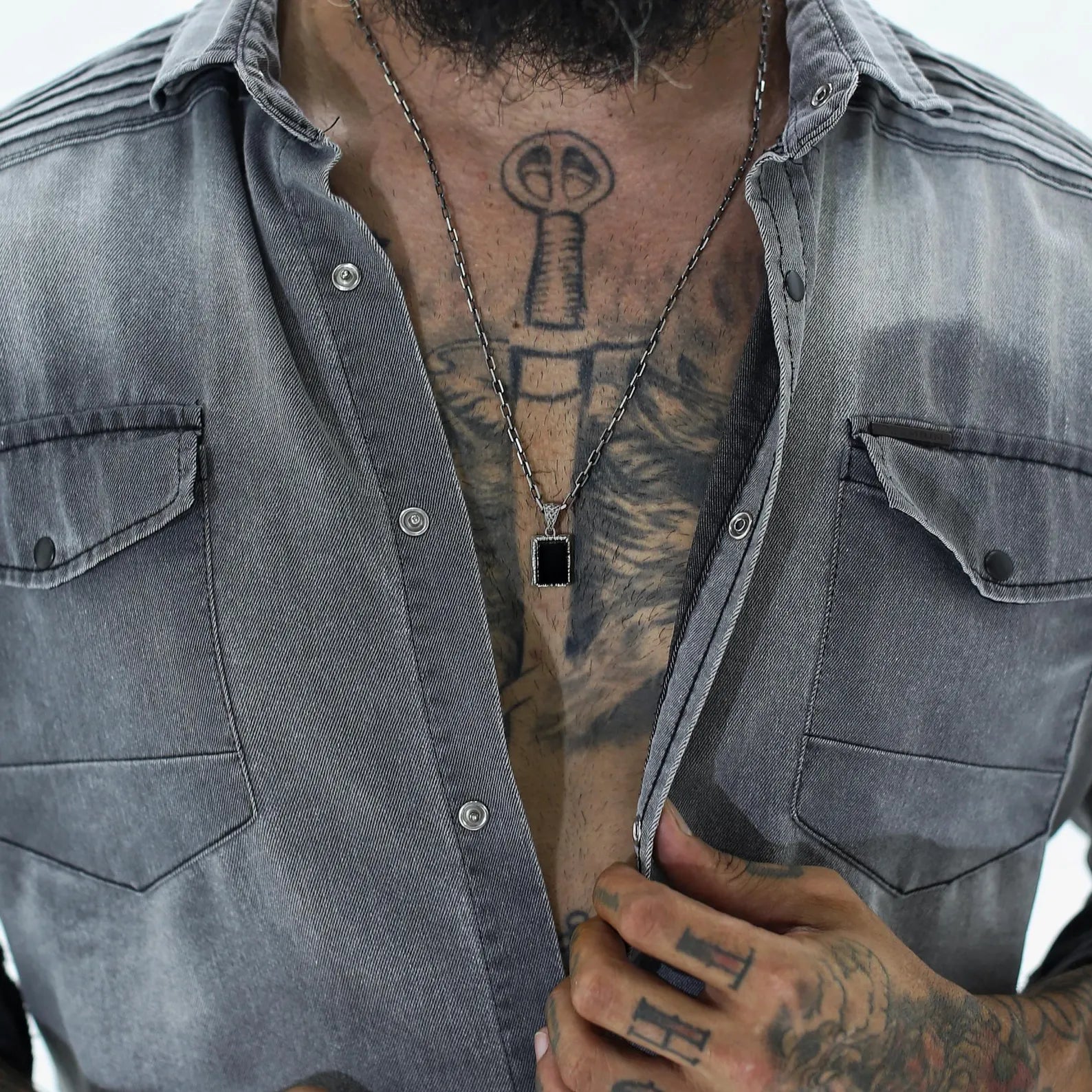 Polished onyx gemstone necklace with ornate vintage-style sterling silver setting. Designed for men who embrace subtle luxury and mysticism, this necklace adds a refined, meaningful touch to every outfit—whether worn alone or layered.