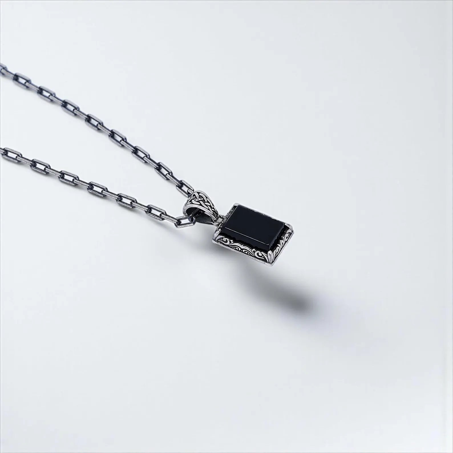 Timeless sterling silver necklace with a handcrafted pendant and black onyx gemstone. Inspired by gothic, boho, and fantasy aesthetics, this elegant piece is a powerful gift idea for husbands, boyfriends, or sons who appreciate artisan jewelry.