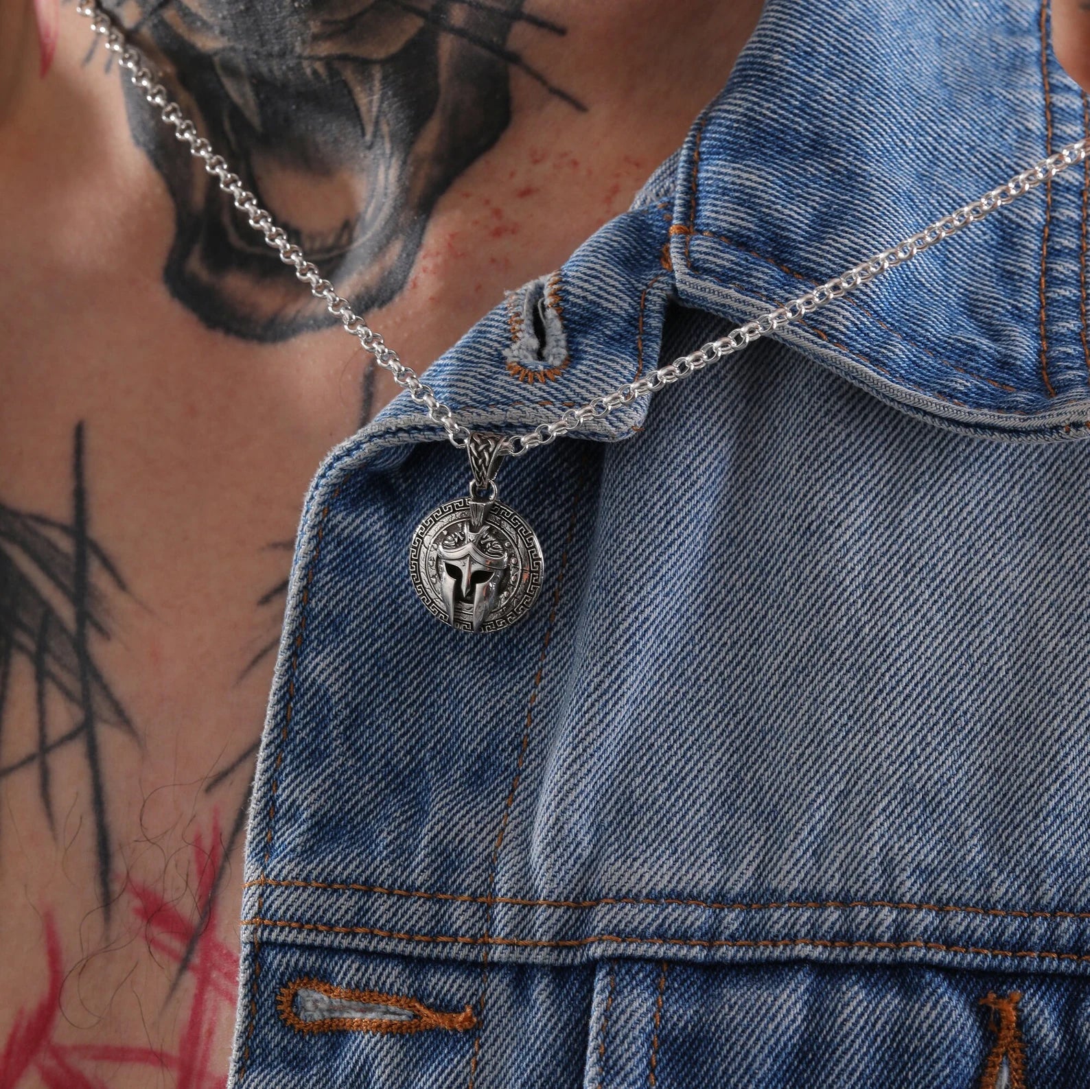 This handcrafted Spartan warrior necklace showcases an antique-style helmet surrounded by a Greek key shield frame. Made in solid sterling silver, it speaks to strength and legacy. Perfect for Spartan fans, fantasy lovers, and gift buyers on Shopify, Pinterest, and Google.