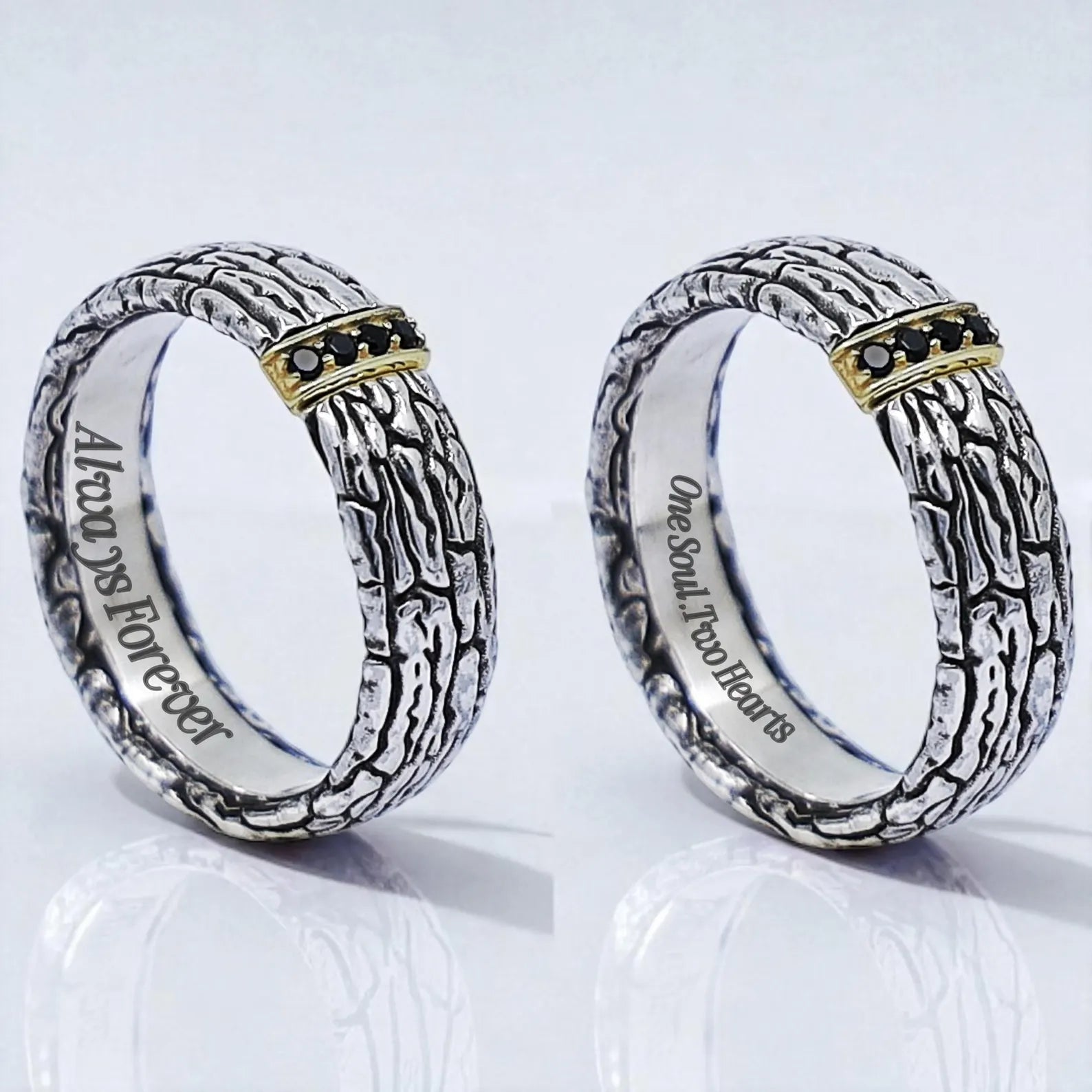Angled side view of a silver ring featuring deeply carved oxidized patterns, highlighted by a polished gold detail holding black stones. The handcrafted craftsmanship and dual-tone finish make it an ideal piece for gothic, minimalist, or urban fashion lovers.