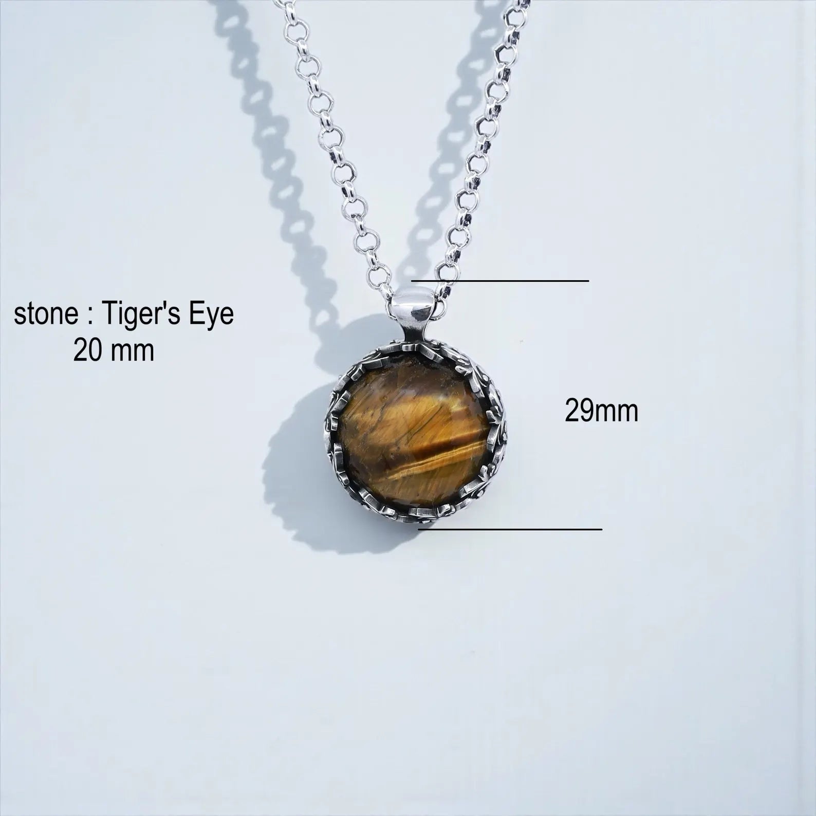Statement tiger eye pendant necklace featuring a richly patterned baroque silver frame and natural protective gemstone, designed for men and women who love artistic, vintage jewelry with spiritual symbolism and handcrafted detailing.