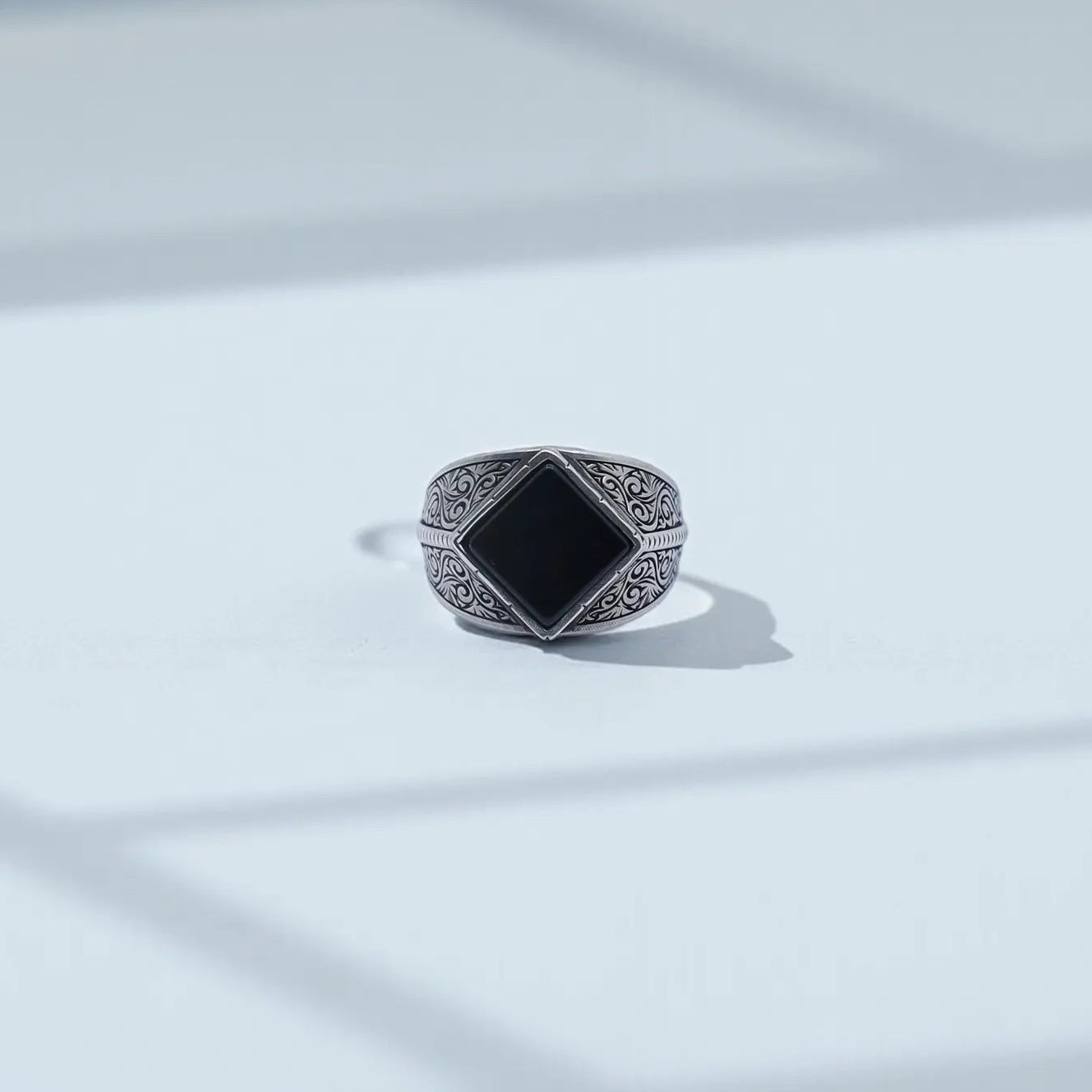 Vintage black onyx signet ring for men photographed on a clean background, showcasing the handcrafted 925 sterling silver baroque engravings and the polished 10x10 natural onyx stone, perfect for SEO searches like “onyx ring men” and “personalized silver signet ring.