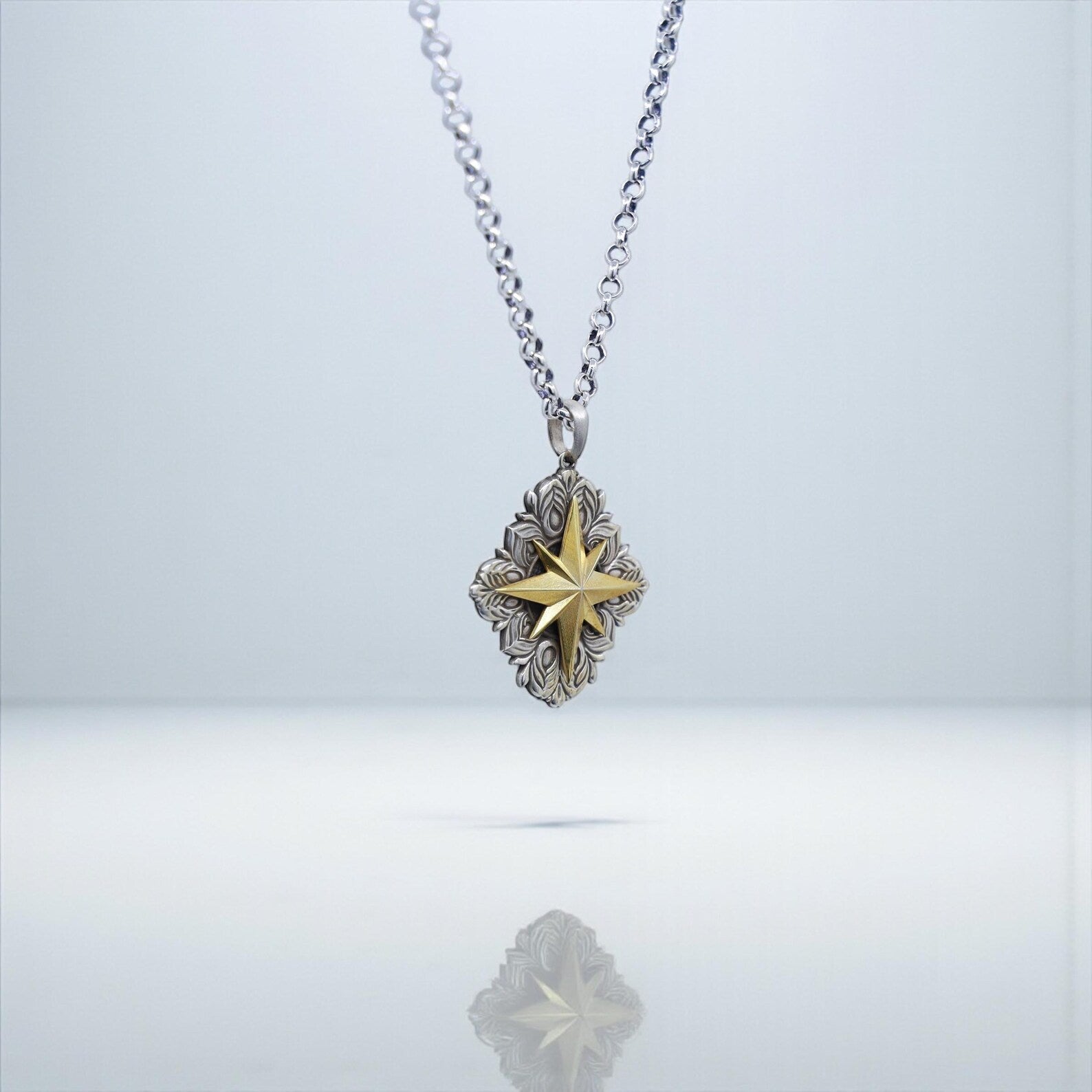 Close-up image capturing the oxidized details of the compass pendant, handcrafted with precision, perfect for SEO phrases such as handmade sailor necklace, maritime jewelry, and gold compass men’s pendant.