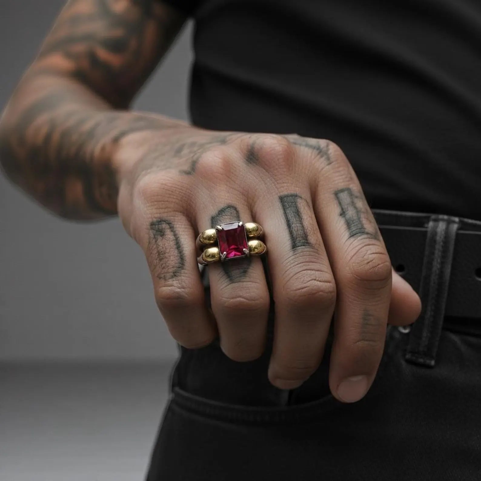 Macro shot of a sterling silver skull ring with emerald stone, showcasing oxidized details, masculine biker style, and handcrafted precision—optimized for gothic fashion ring, unique mens jewelry, and personalized skull ring.