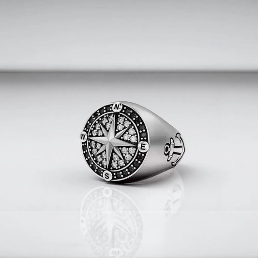 Handcrafted 925 sterling silver nautical compass ring for men featuring a bold North Star design and cubic zircon gems, perfect adventure gift for sailors and ocean lovers.