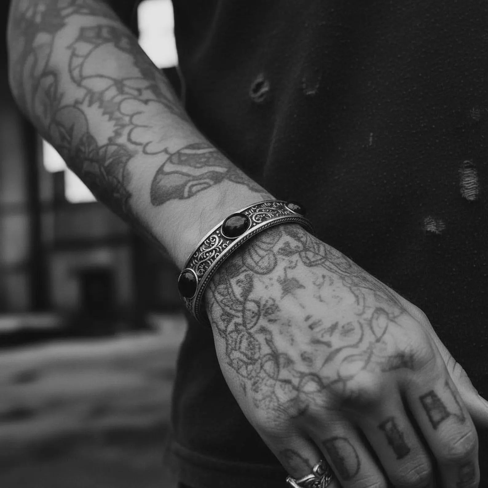 Handcrafted sterling silver onyx cuff with vintage engraving and thick masculine design, perfect for bikers, trendsetters, and men who love unique statement gemstone jewelry.