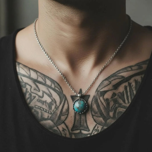Premium men’s turquoise gemstone pendant necklace made from solid 925 sterling silver with a meticulously handcrafted baroque-inspired frame, featuring swirling silver leaf motifs that embrace a natural turquoise stone known for its spiritual balance and protective qualities; an elegant and timeless artisan necklace ideal for men who appreciate unique, high-quality gemstone jewelry.