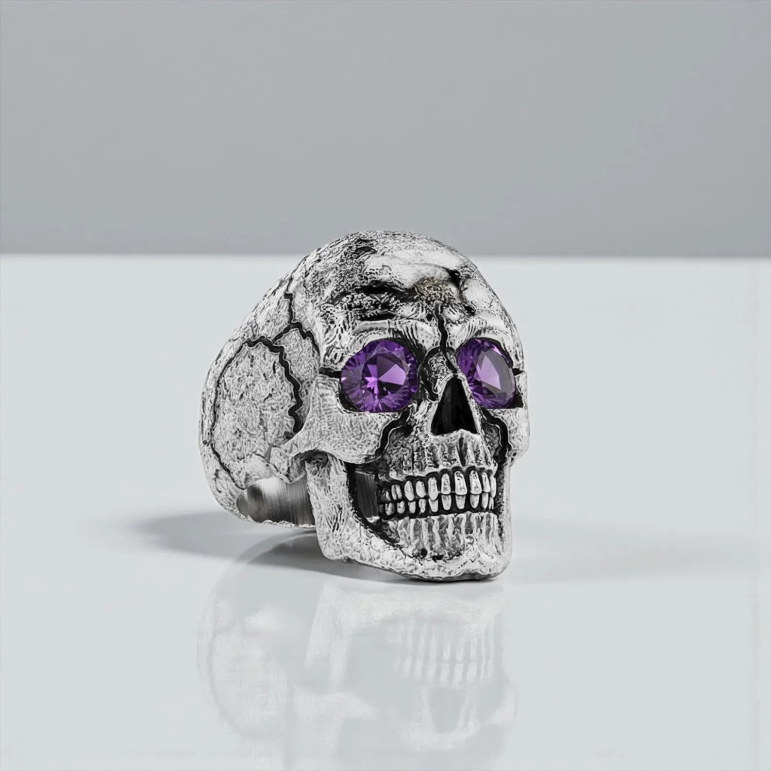 Luxury sterling silver skeleton ring with brushed matte finish and turquoise gemstone centerpiece, perfectly suited for men seeking bold and artistic biker jewelry. Customizable with engraved initials, dates, or symbols, offering emotional value. A powerful accessory for motorcycle enthusiasts.