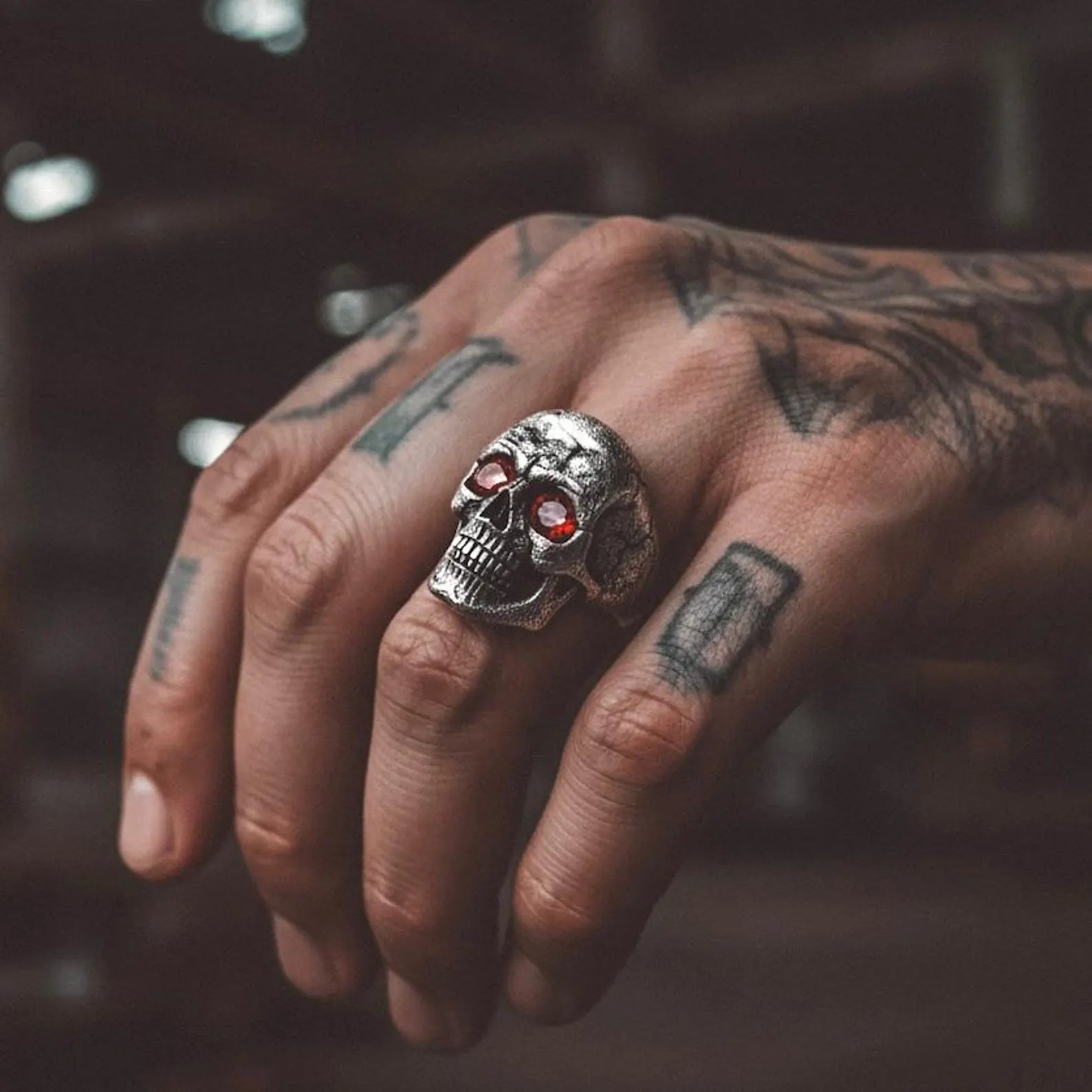 Harley-Davidson inspired silver skull ring featuring detailed bone structures and a high-quality turquoise stone. This handmade piece embodies rebellion, freedom, and masculine power, finished with oxidized depth for a dramatic effect. Great as a personalized biker gift for special occasions.
