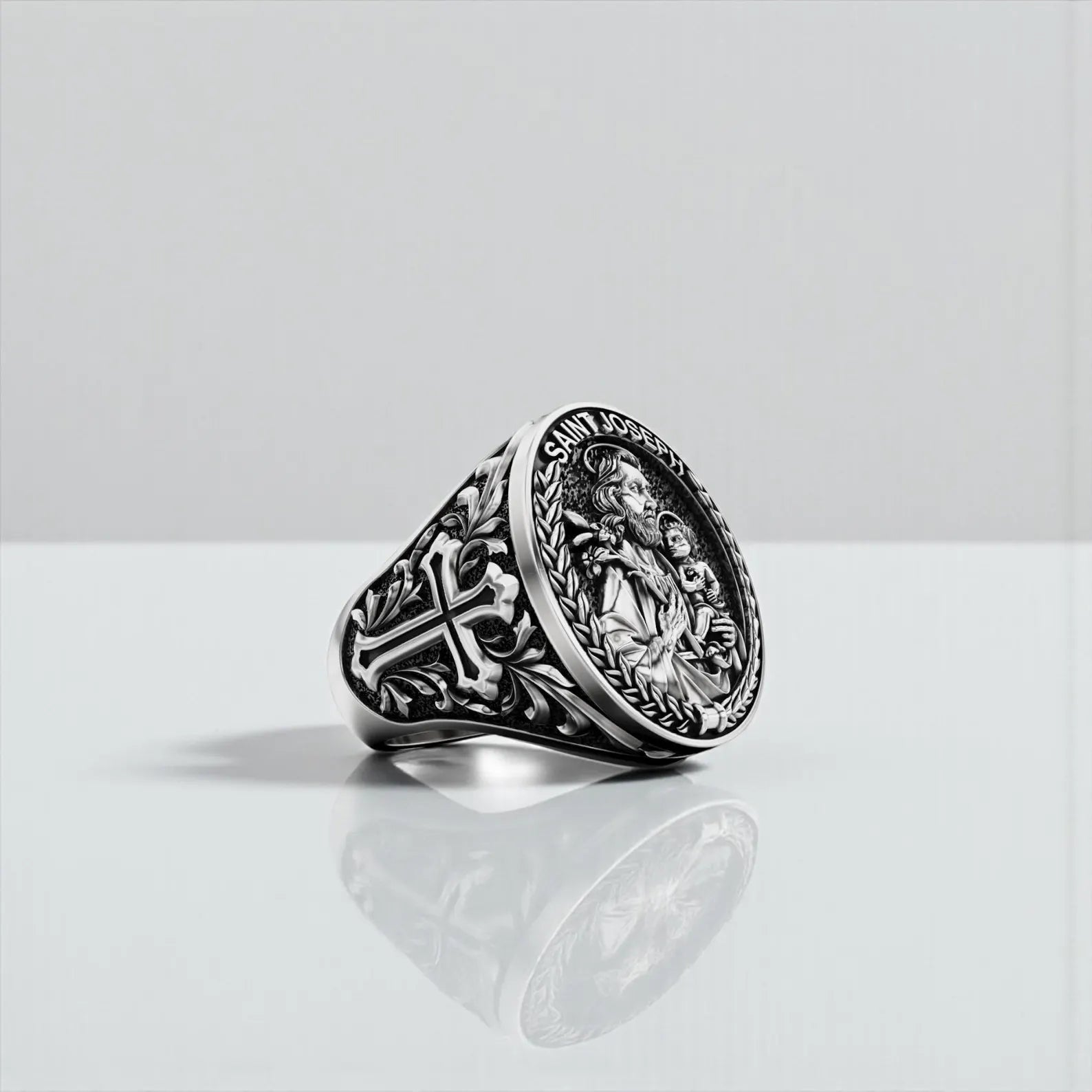 Oxidized sterling silver cross ring featuring Saint Joseph artistry, combining religious symbolism with masculine elegance. Ideal for collectors of Christian jewelry and those seeking meaningful accessories.