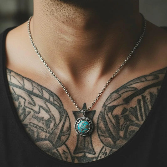 Macro shot of the natural turquoise gemstone showcasing its rich blue-green tones and handcrafted sterling silver bezel. The rugged Southwestern rope border adds character and depth. This detailed view highlights the artisan craftsmanship and bold masculine design—perfect for customers searching for turquoise jewelry, gemstone pendants, and handmade silver gifts.