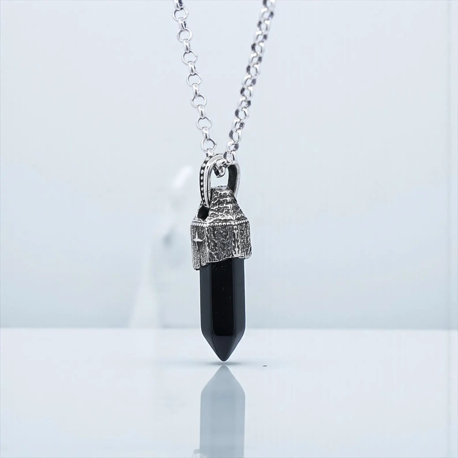 Vintage-style men’s obsidian pendant necklace with a pointed natural obsidian gemstone encased in 925 sterling silver, featuring compass etching and hand-polished oxidized finish, ideal as a protective spiritual accessory.