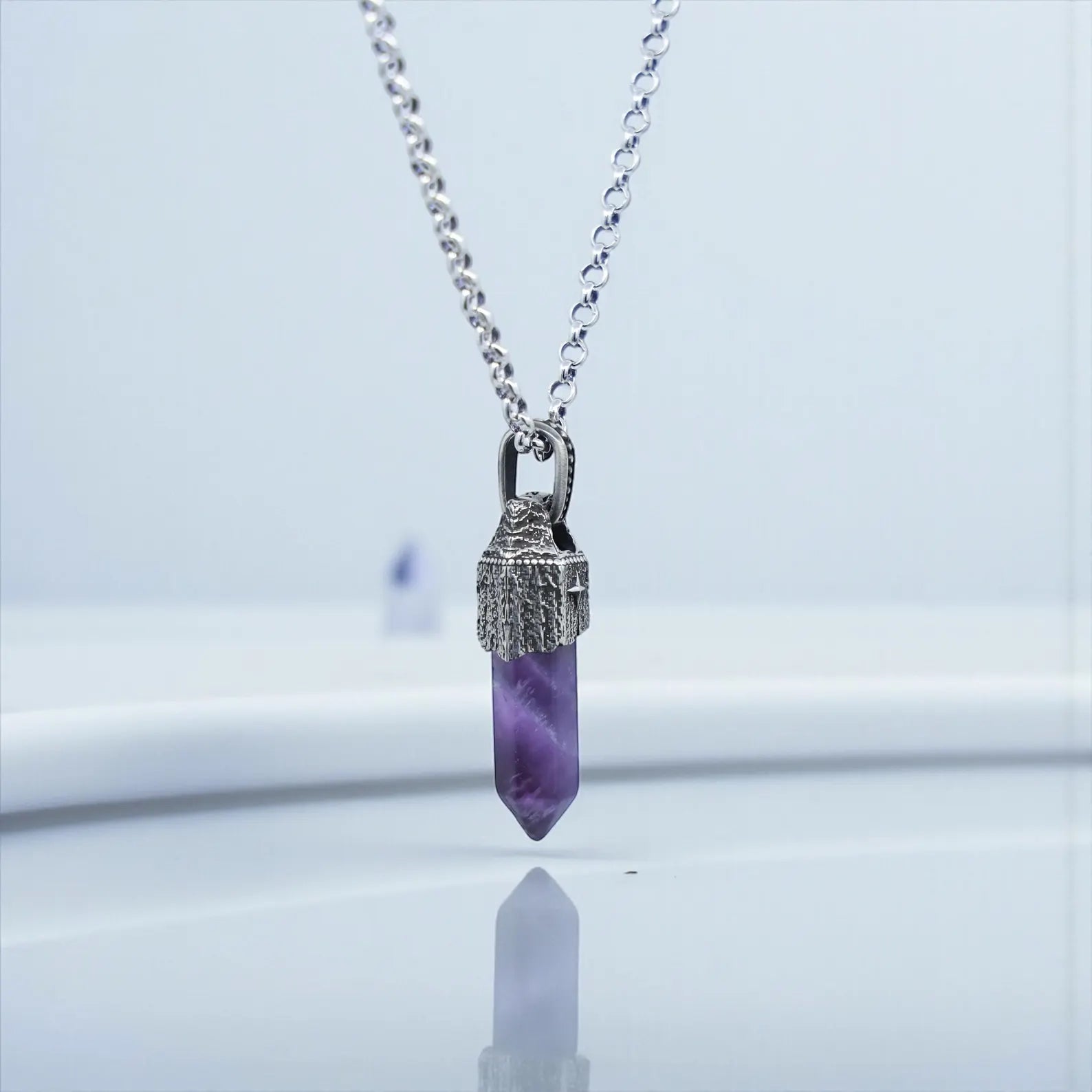 Sterling silver amethyst gemstone pendant necklace photographed against a clean studio background, showcasing the natural gemstone clarity, oxidized handcrafted frame, and 40mm vintage pendant design.